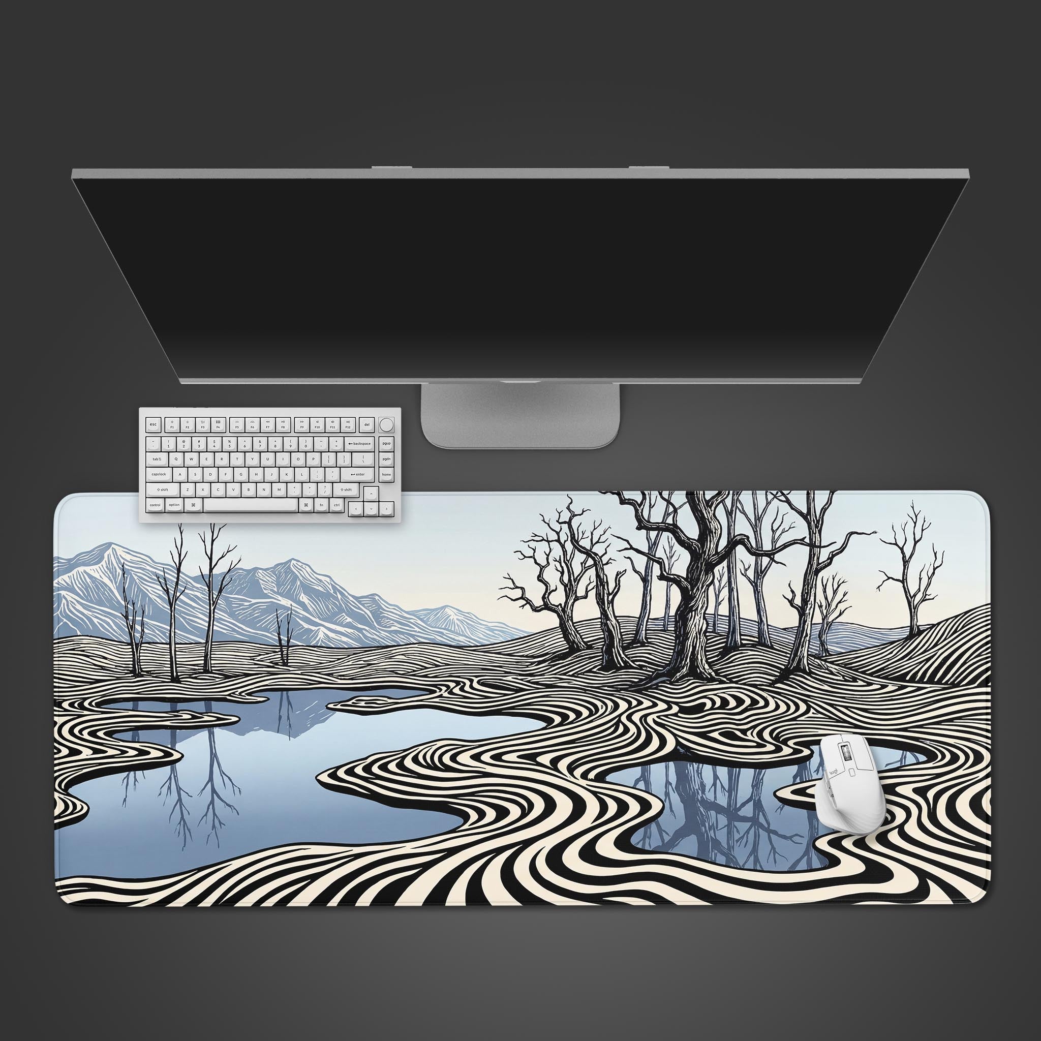 Top-down view of the Ripple Effect gaming desk mat, featuring a hypnotic black, white, and blue landscape design with a white keyboard and mouse. - Epic Design Pads & Mousepads