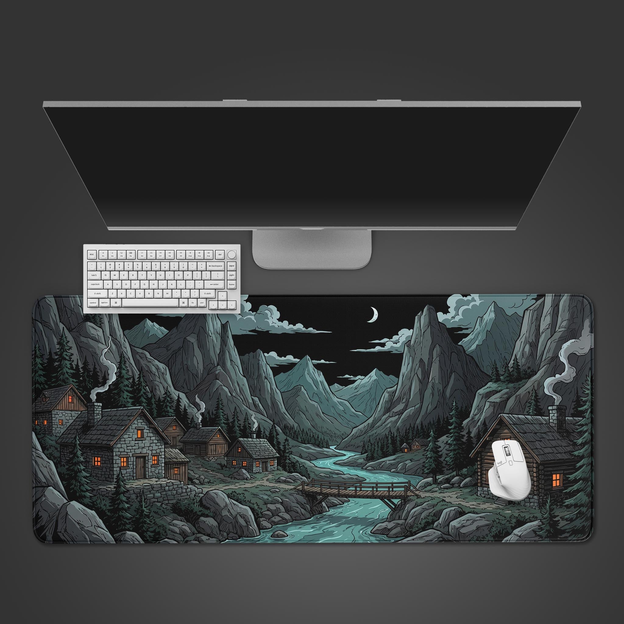 A top-down view of the River Night gaming desk mat, featuring a mountain village illustration, with a white keyboard and mouse on a dark gray background. - Epic Design Pads & Mousepads
