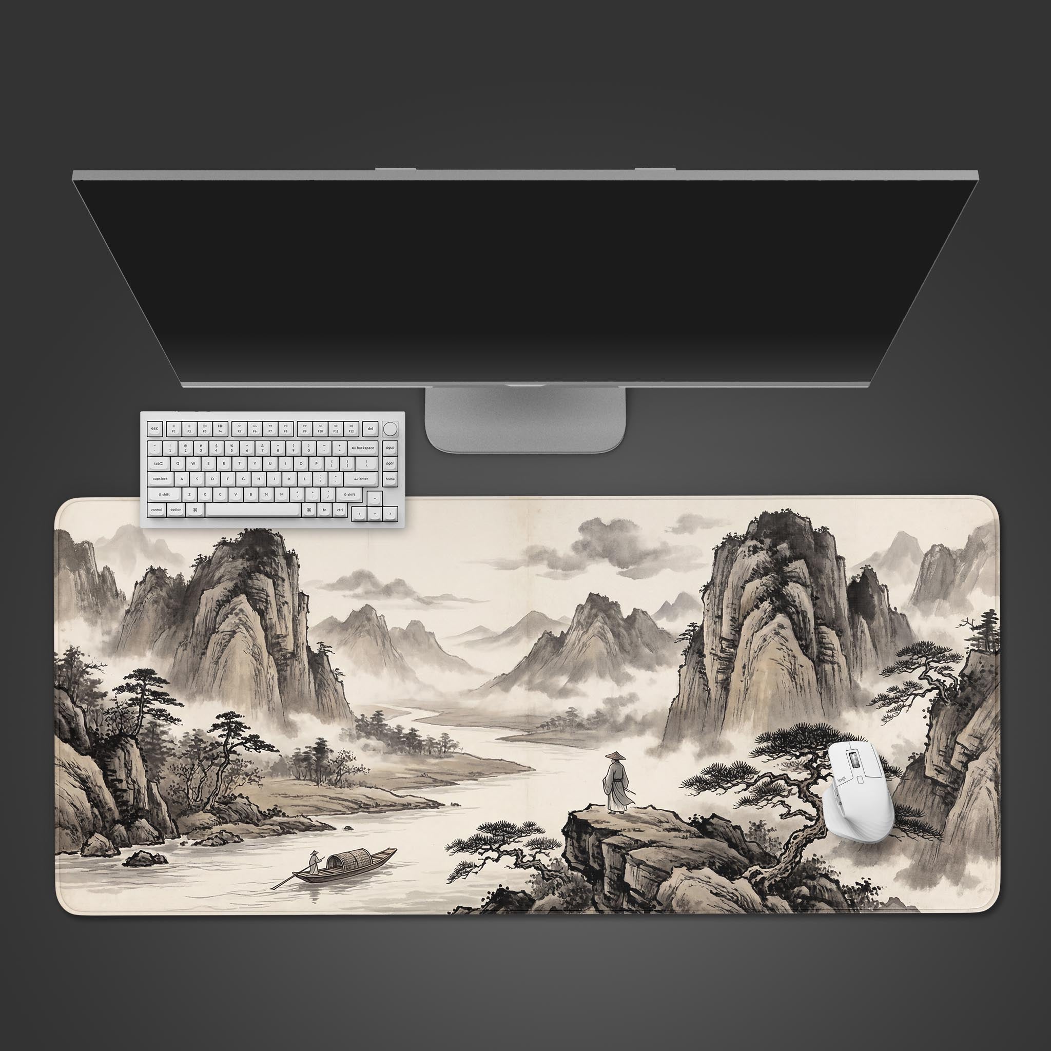 Top-down view of the River Solitude gaming desk mat, featuring a Chinese ink painting of mountains. A white keyboard and mouse are shown on the mat below a monitor. - Epic Design Pads & Mousepads