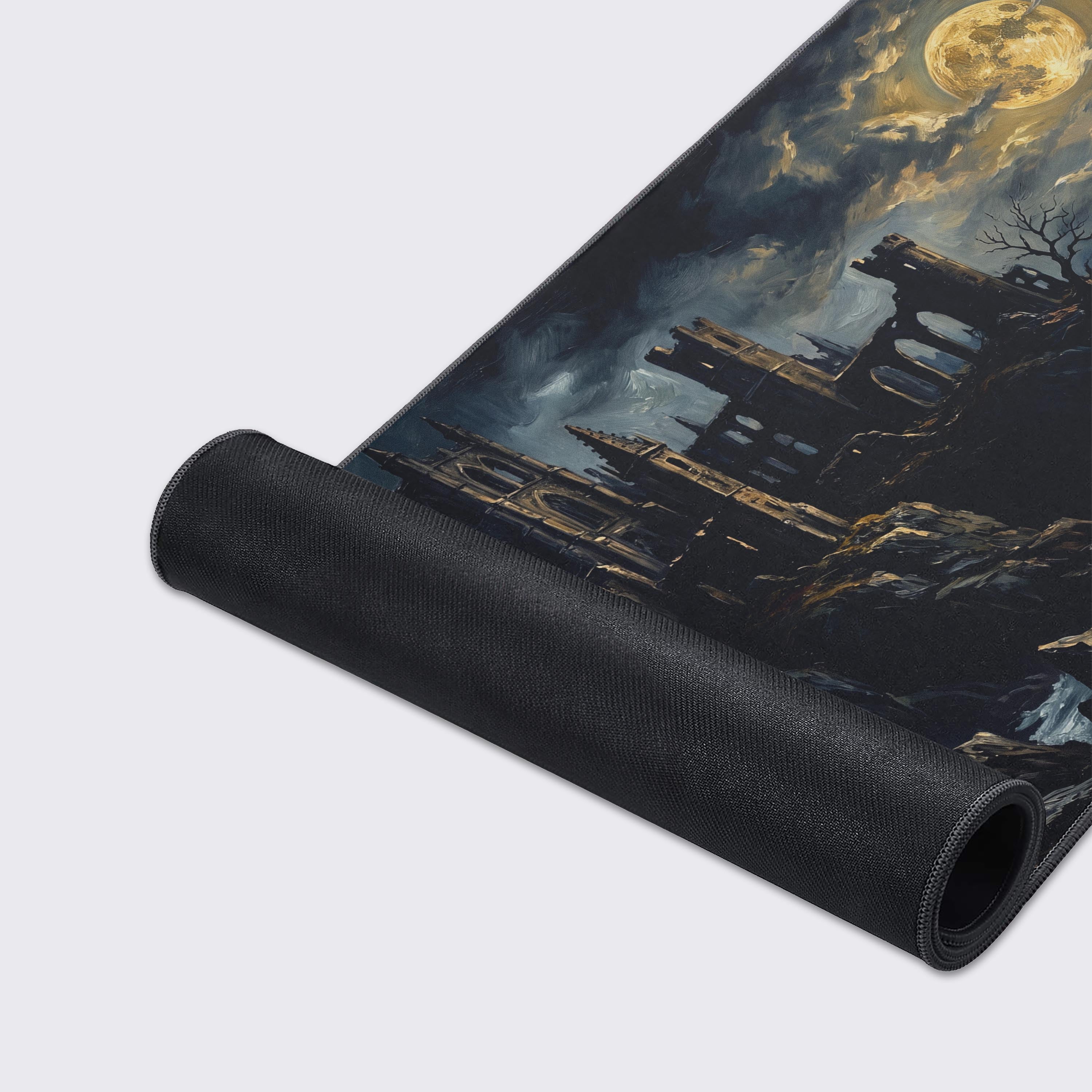 Top-down view of the epic dark fantasy mouse pad showing the sweeping clouds and rugged cliff terrain.