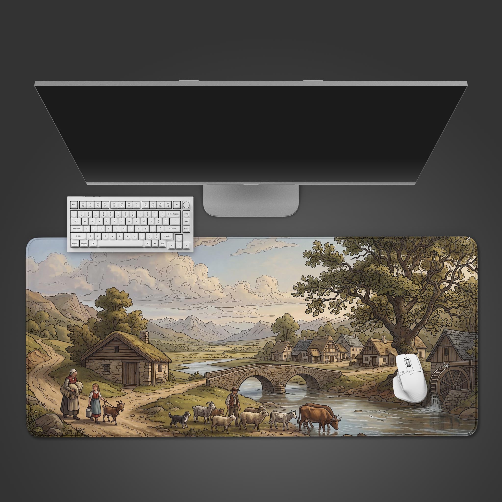 Top-down view of the Rustic Watermill gaming desk mat featuring a pastoral village scene, shown with a white keyboard and mouse. - Epic Design Pads & Mousepads