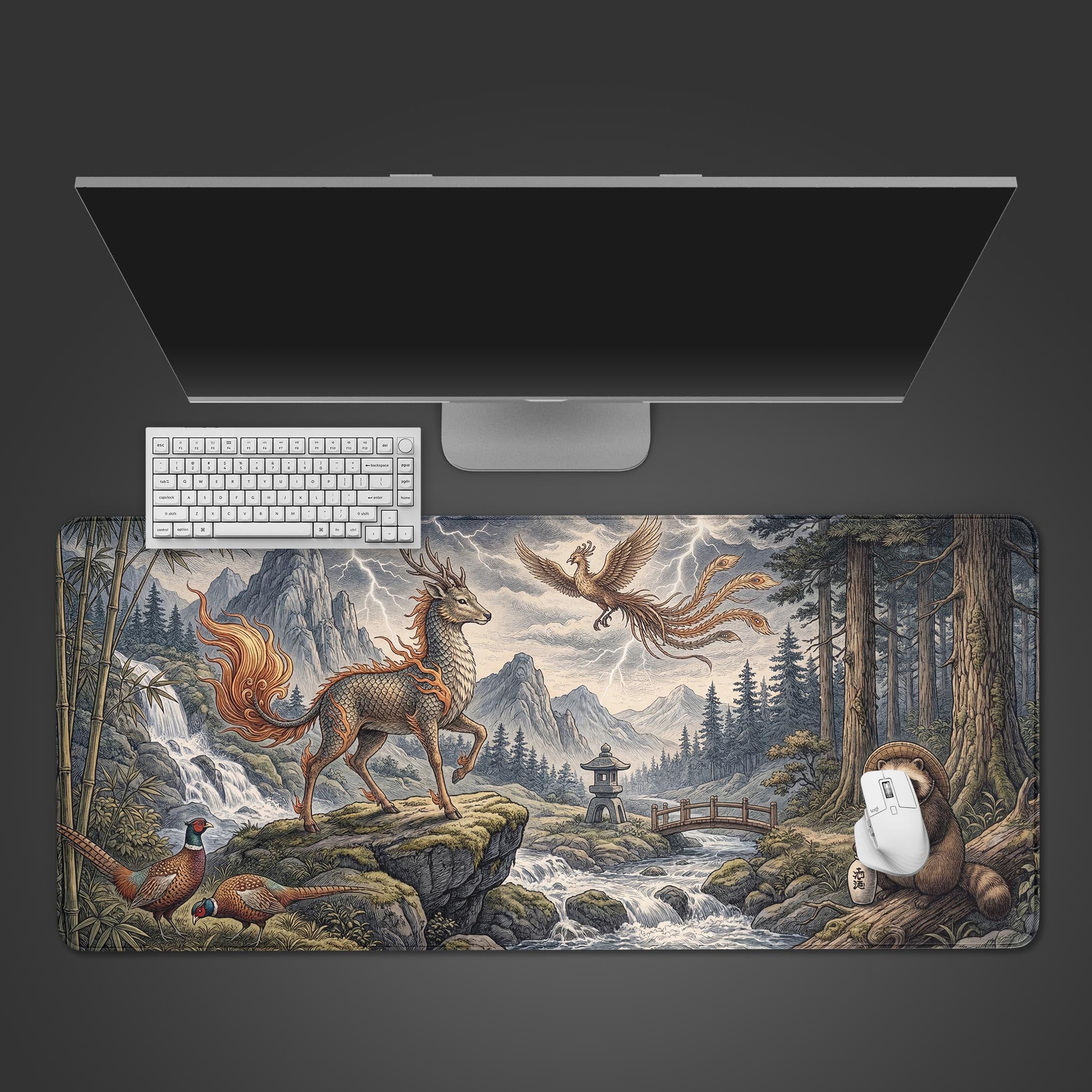 A top-down view of the Sacred Harmony gaming desk mat, showcasing its Japanese art style with a Kirin and Phoenix, placed below a monitor and keyboard. - Epic Design Pads & Mousepads