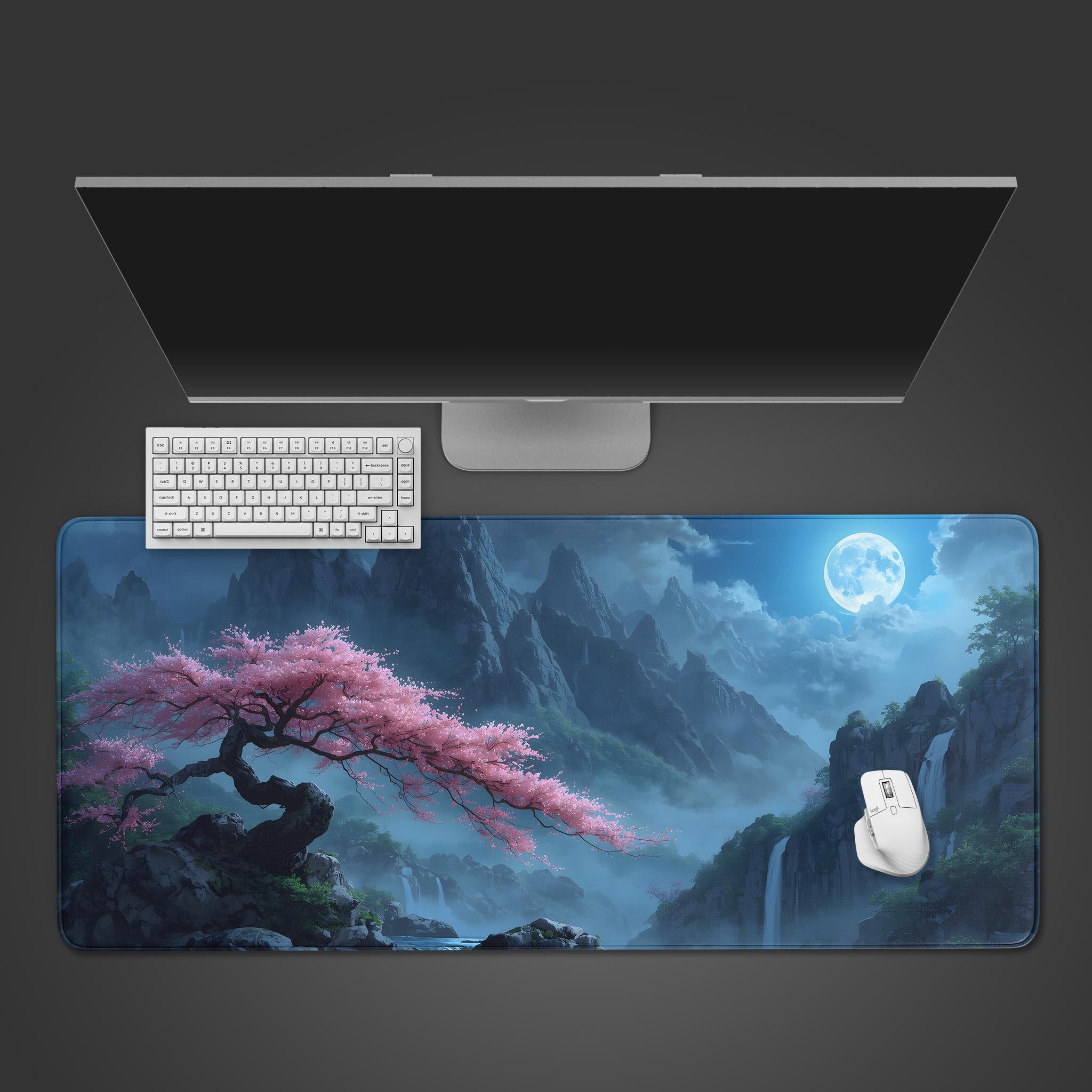 Sakura Falls desk mat featuring a cherry blossom and waterfall landscape. Top-down view on a desk with a white keyboard and mouse, showcasing the large surface area. - Epic Design Pads & Mousepads