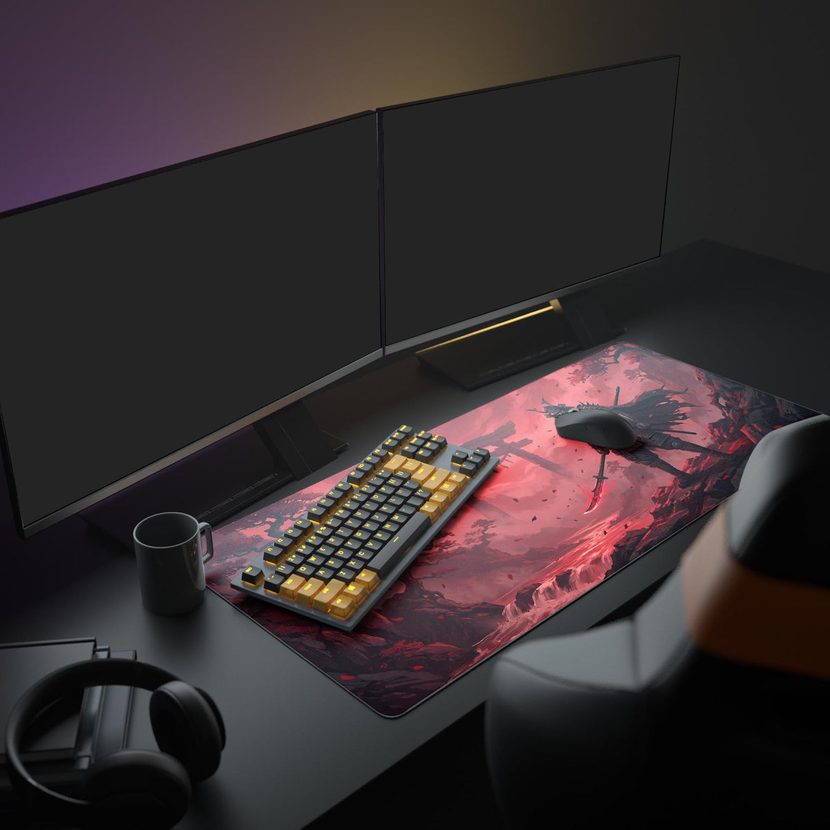 Red samurai desk mat on a dark desk under two monitors with a black and yellow keyboard, mouse, mug and headphones