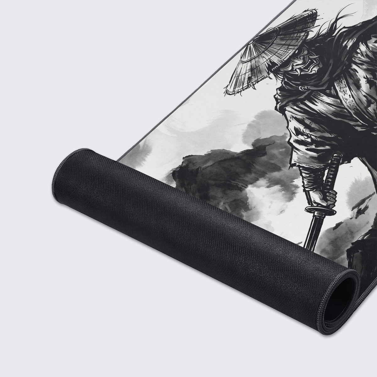 Full view of the monochromatic samurai desk mat hovering over a reflective surface.