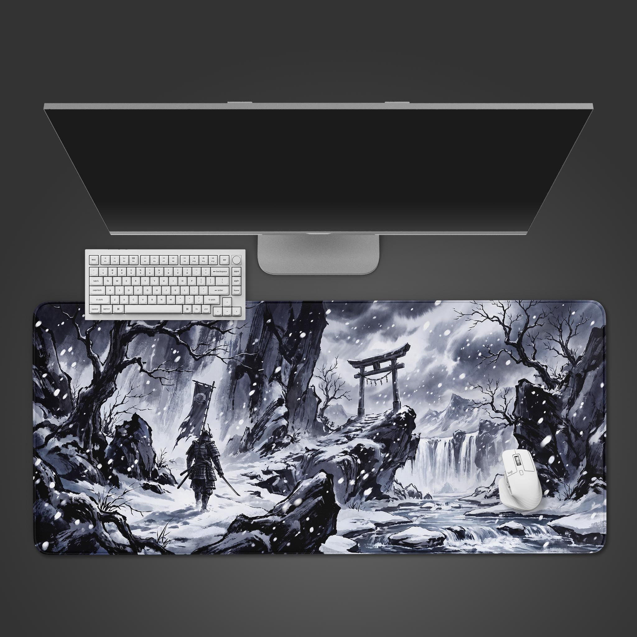 A snowy Japanese landscape desk mat featuring a lone samurai walking towards a torii gate.