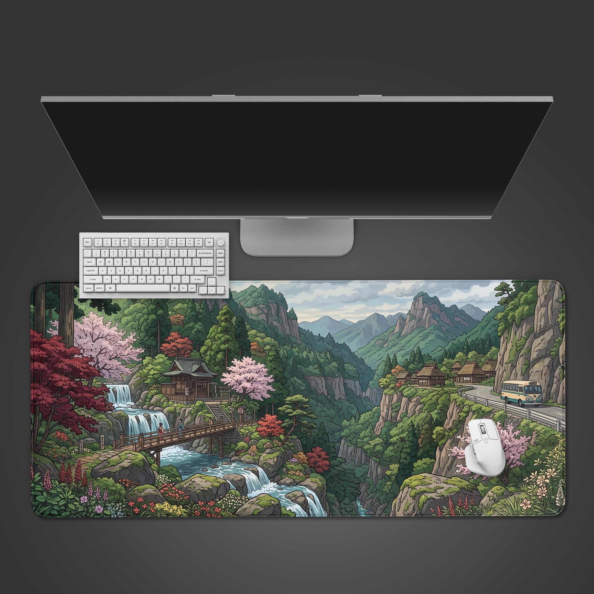 A top-down view of the Scenic Route gaming desk mat, showing the Japanese mountain landscape design beneath a sleek monitor, keyboard, and white mouse. - Epic Design Pads & Mousepads