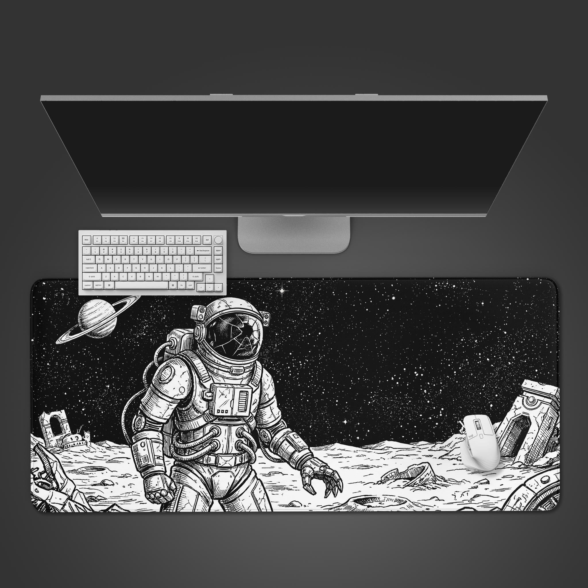 A top-down view of the Shattered Void astronaut gaming desk mat, shown with a white keyboard and mouse on a dark surface, highlighting the full black-and-white design. - Epic Design Pads & Mousepads