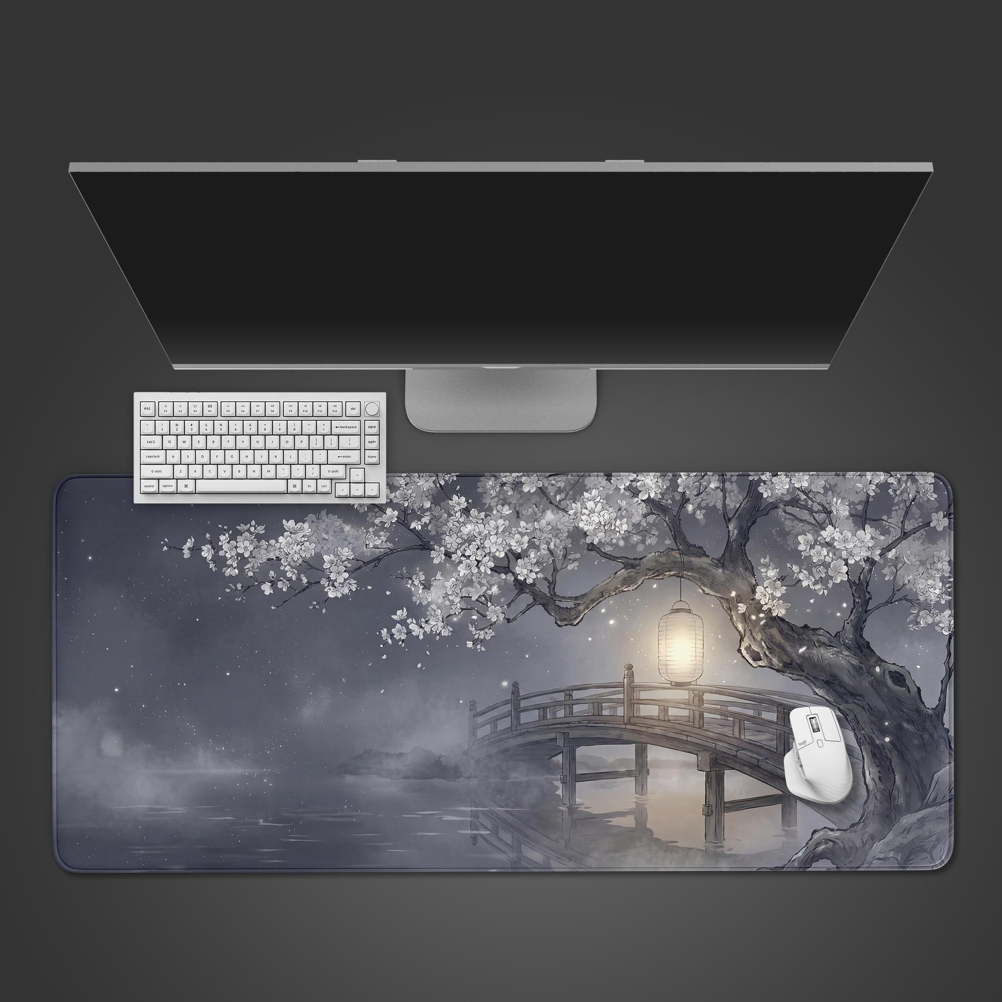 The Silent Crossing Gaming Desk Mat shown from above with a white keyboard and mouse, featuring a Japanese ink wash art style with a bridge and cherry blossoms. - Epic Design Pads & Mousepads