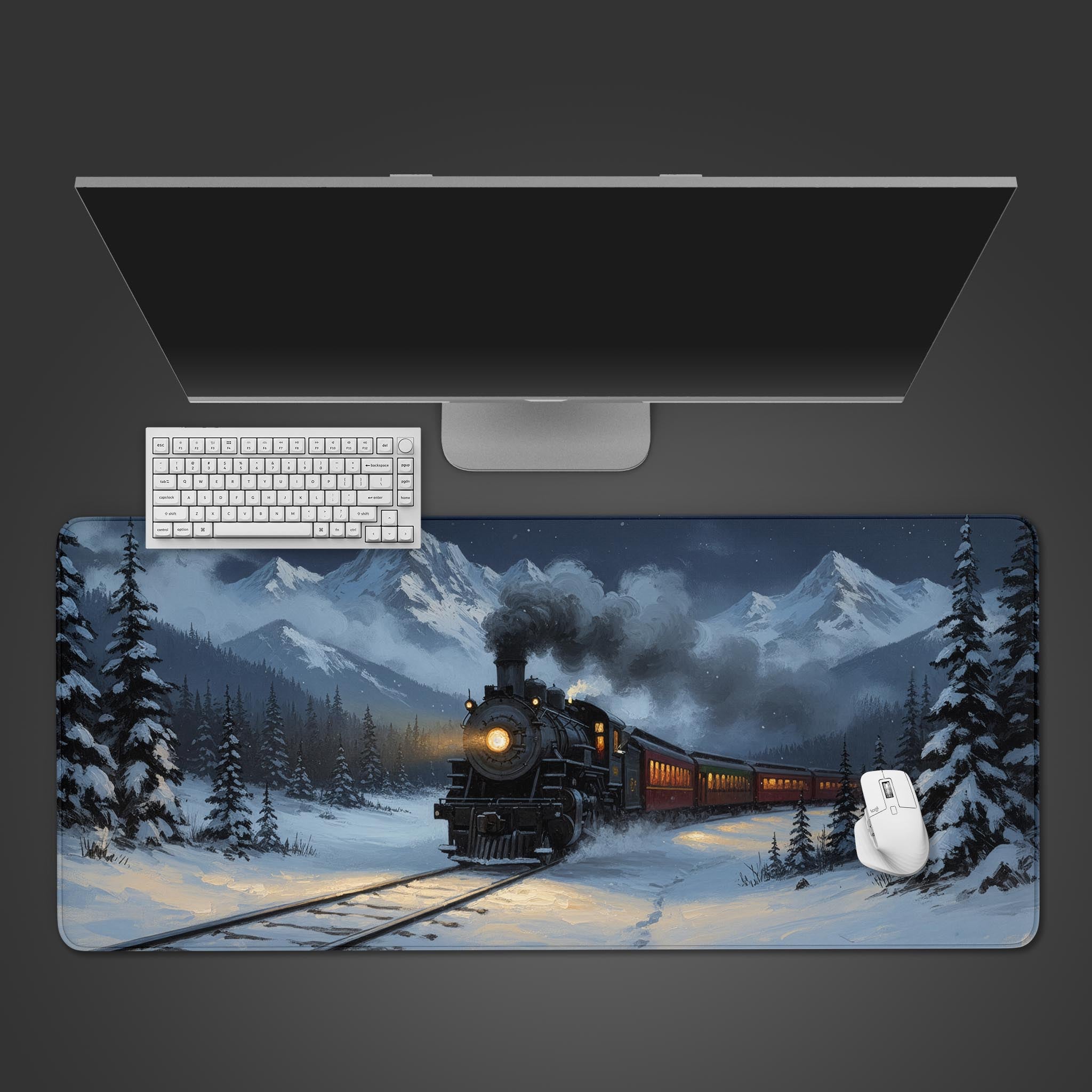 Solstice Express desk mat with snowy train and mountain design – top-down view on a desk with a keyboard and mouse. - Epic Design Pads & Mousepads