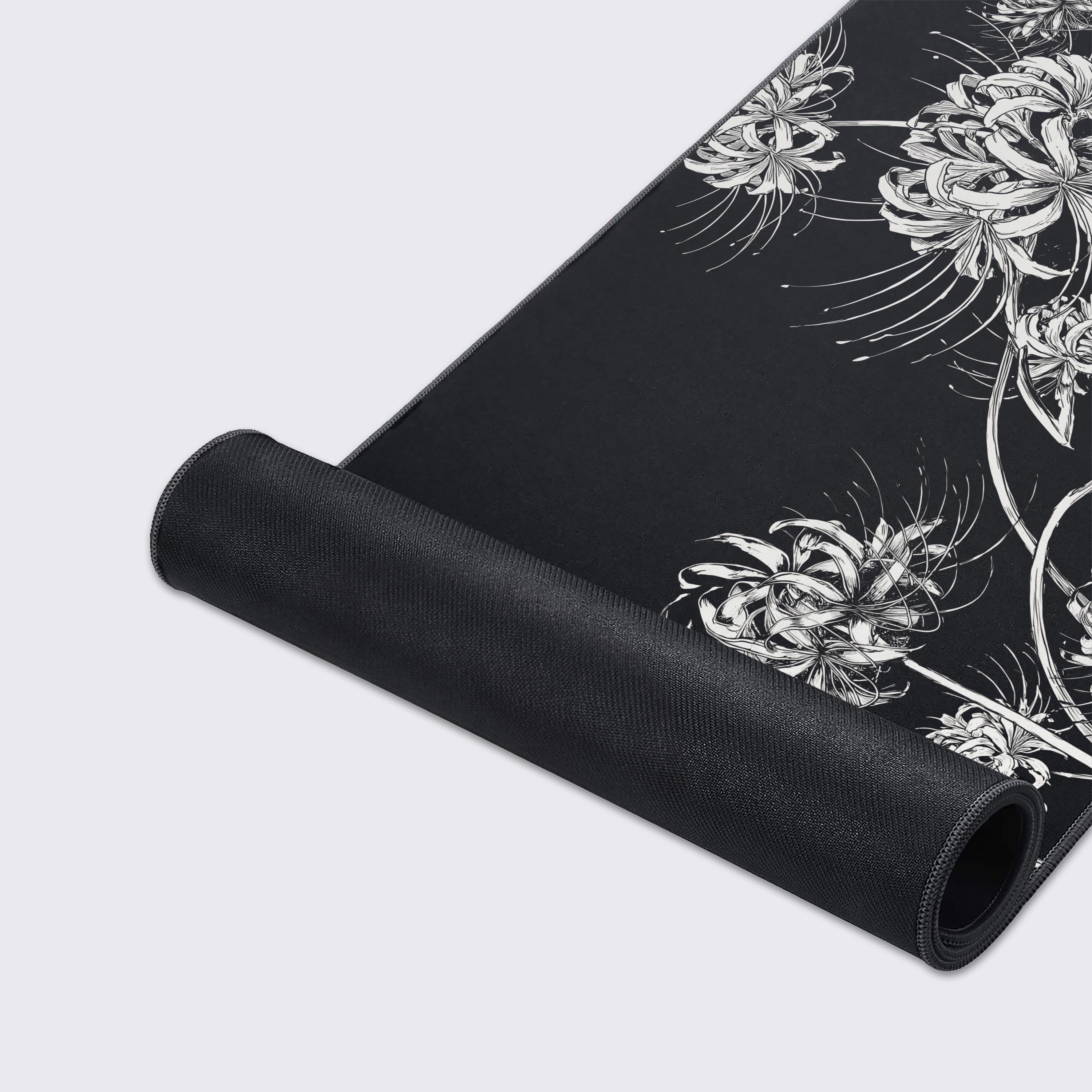 Dark aesthetic minimalist desk mat with white spider lilies and waterproof surface features highlighted