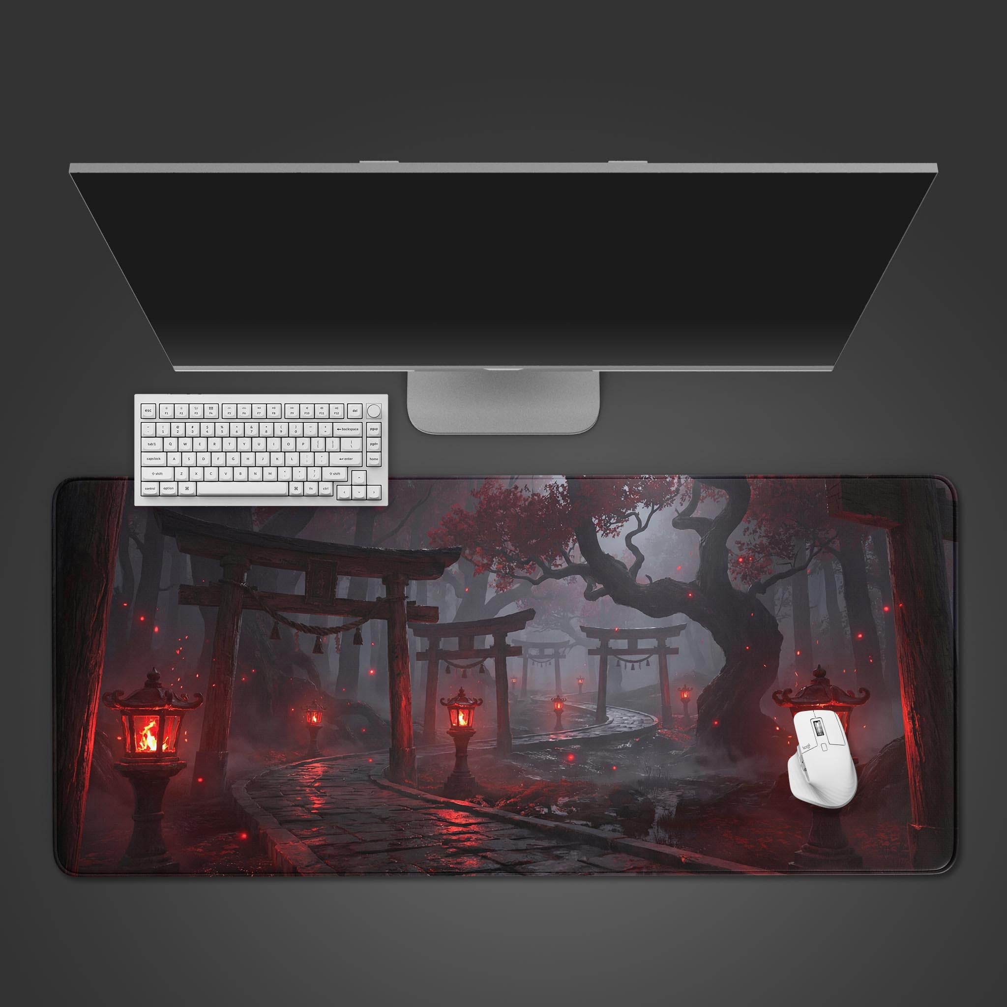 A top-down view of the Spirit Gate Way gaming desk mat, showing the dark forest and red torii gates design with a white keyboard and mouse. - Epic Design Pads & Mousepads