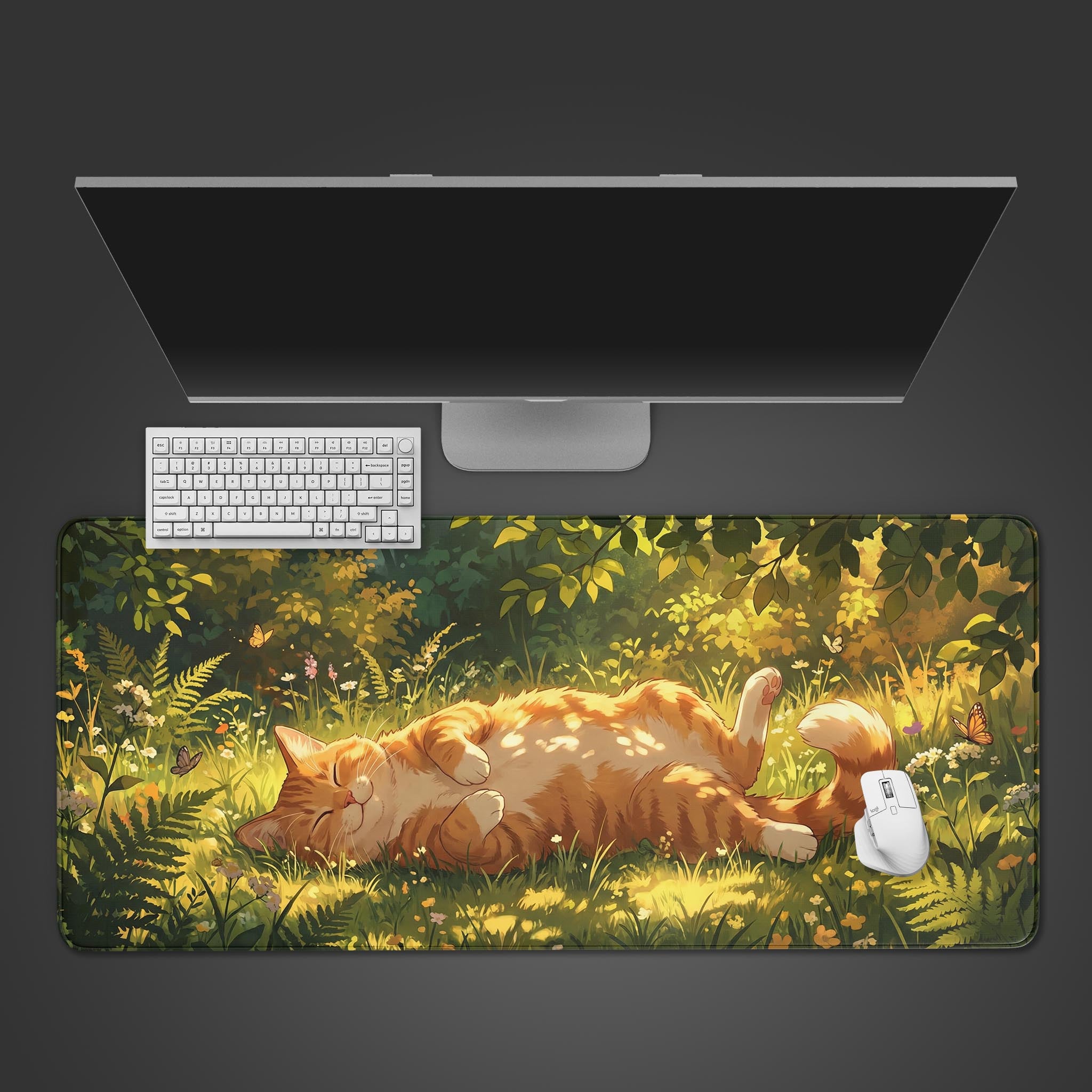 Top-down view of the Sunlit Slumber cat gaming desk mat, shown with a white keyboard and mouse on a dark surface. The design features a sleeping orange cat in a sunlit forest. - Epic Design Pads & Mousepads