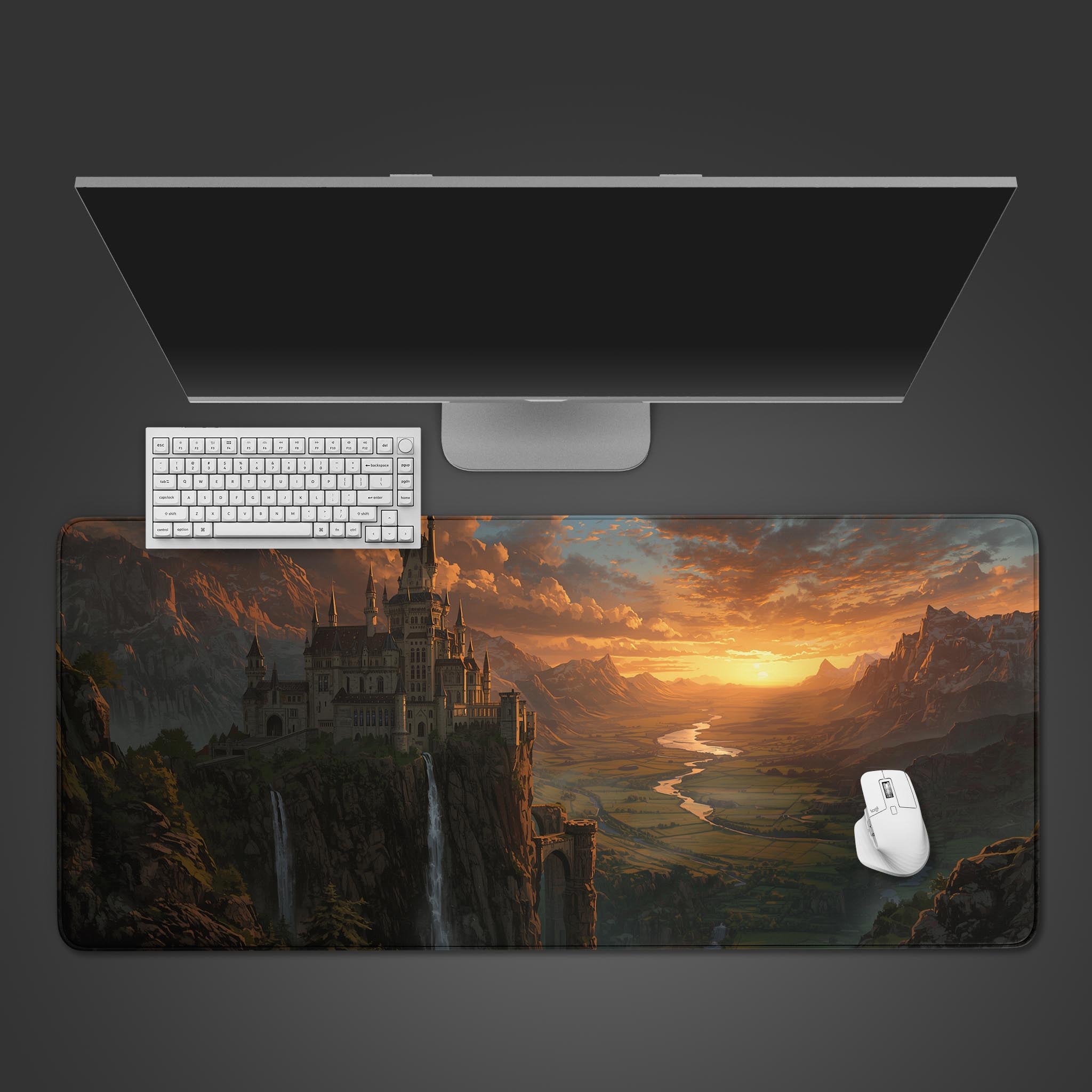 Sunset Citadel fantasy desk mat with an epic castle design, shown from a top-down view with a black keyboard and mouse. - Epic Design Pads