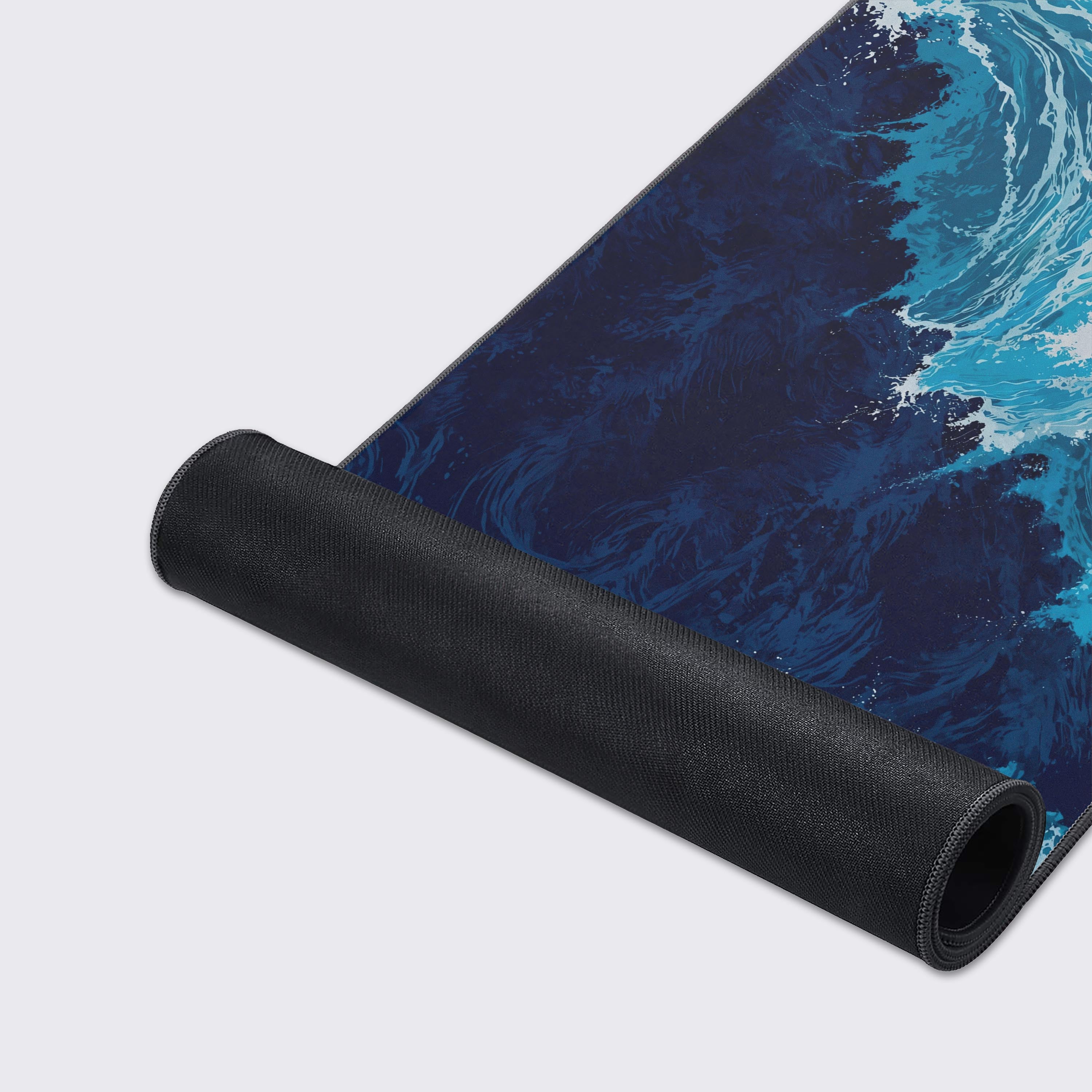 Tempest Waves desk mat feature icons highlighting waterproof and non-slip rubber base