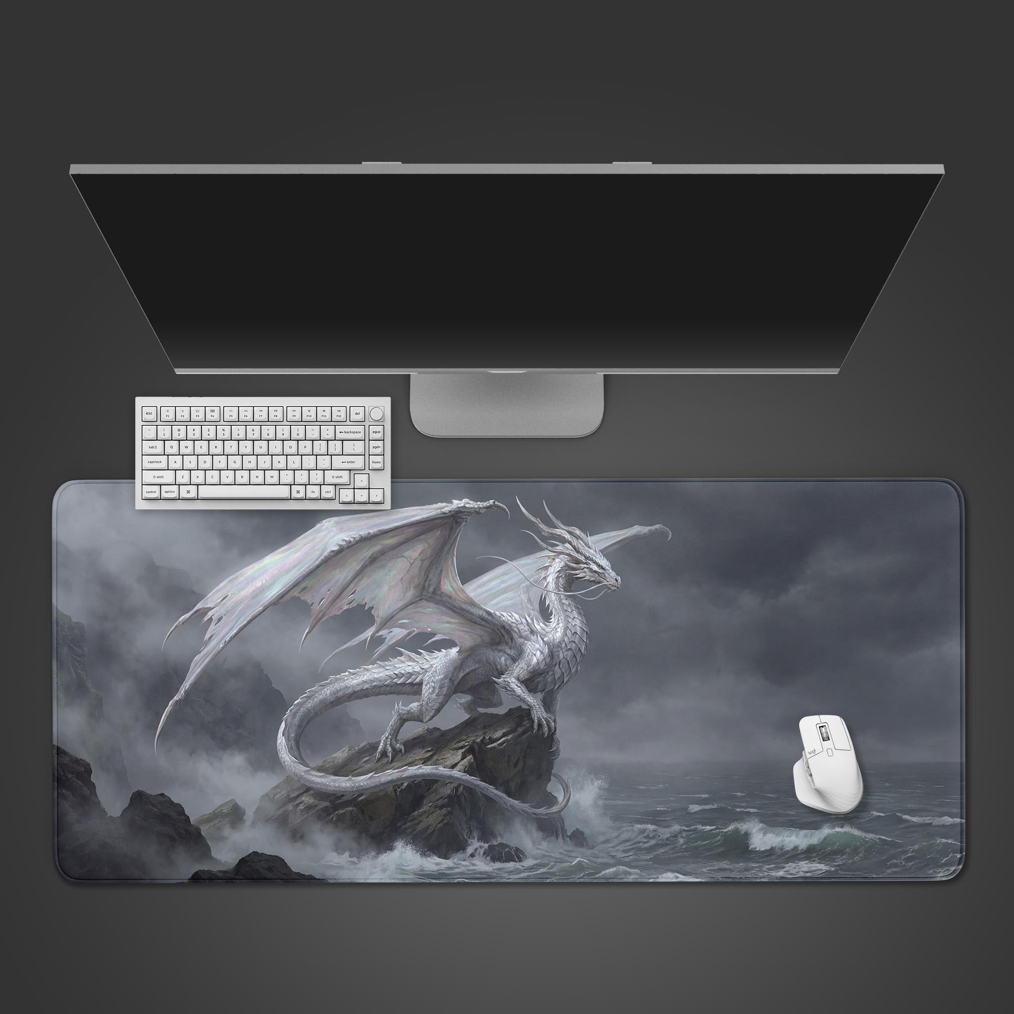 Top-down view of the Tempest Wyrm Gaming Desk Mat featuring a white dragon, shown with a white keyboard and mouse on a dark desk. - Epic Design Pads & Mousepads
