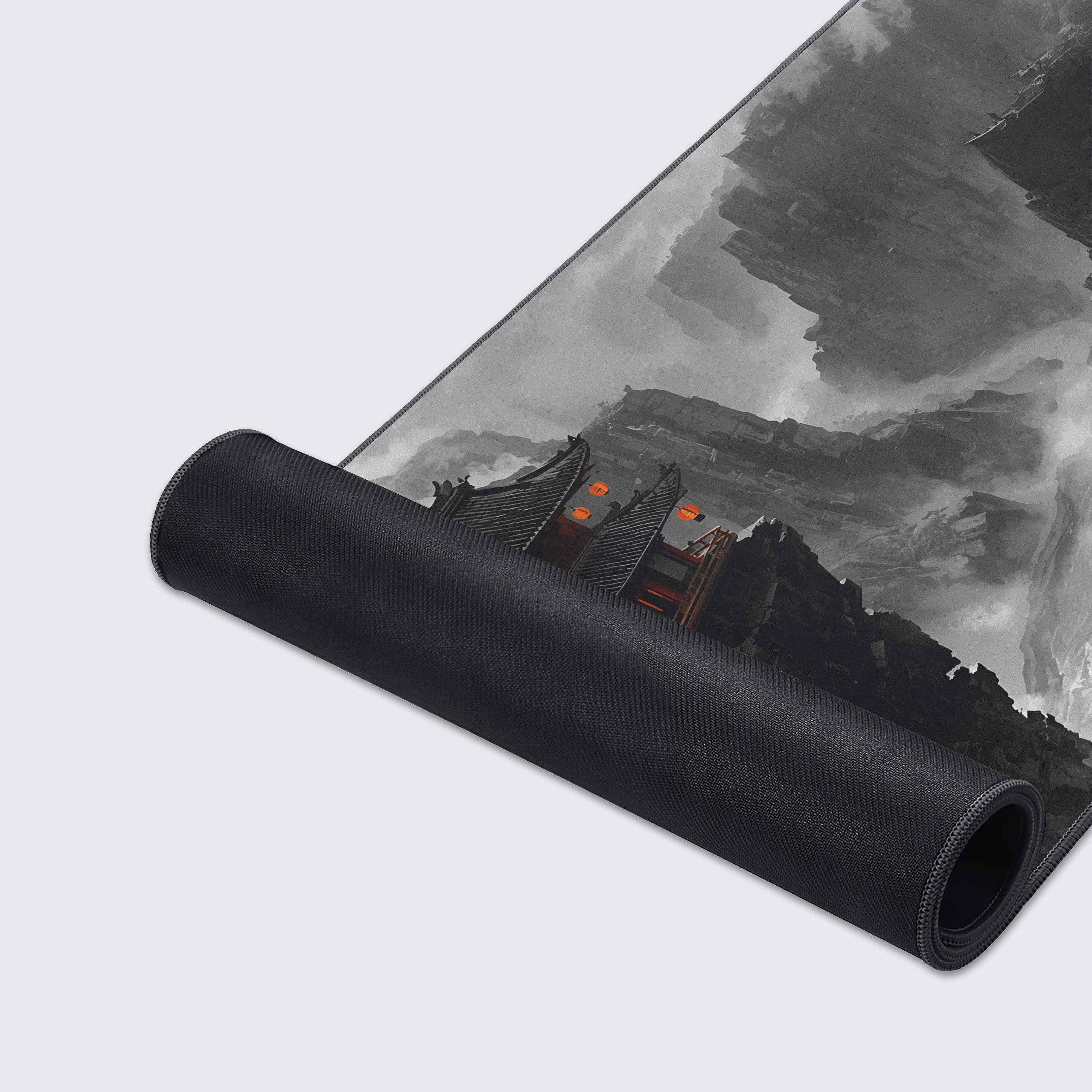 Wide view of the sweeping ink wash style mountains and deep misty canyon portrayed on the XL desk mat.