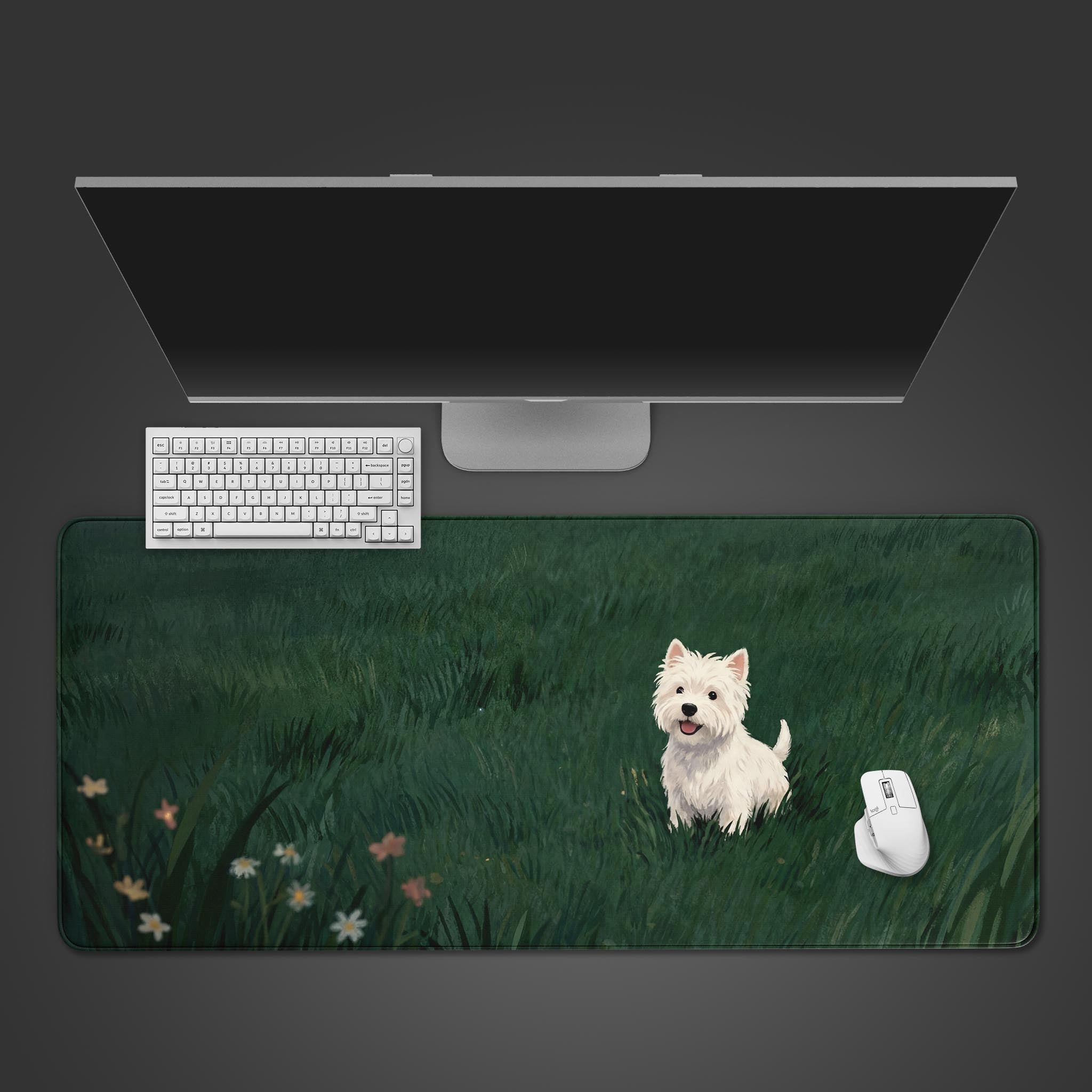 A top-down view of 'The Little Scout' gaming desk mat, featuring a cute Westie in a green field, shown with a white keyboard and mouse on a dark surface. - Epic Design Pads & Mousepads
