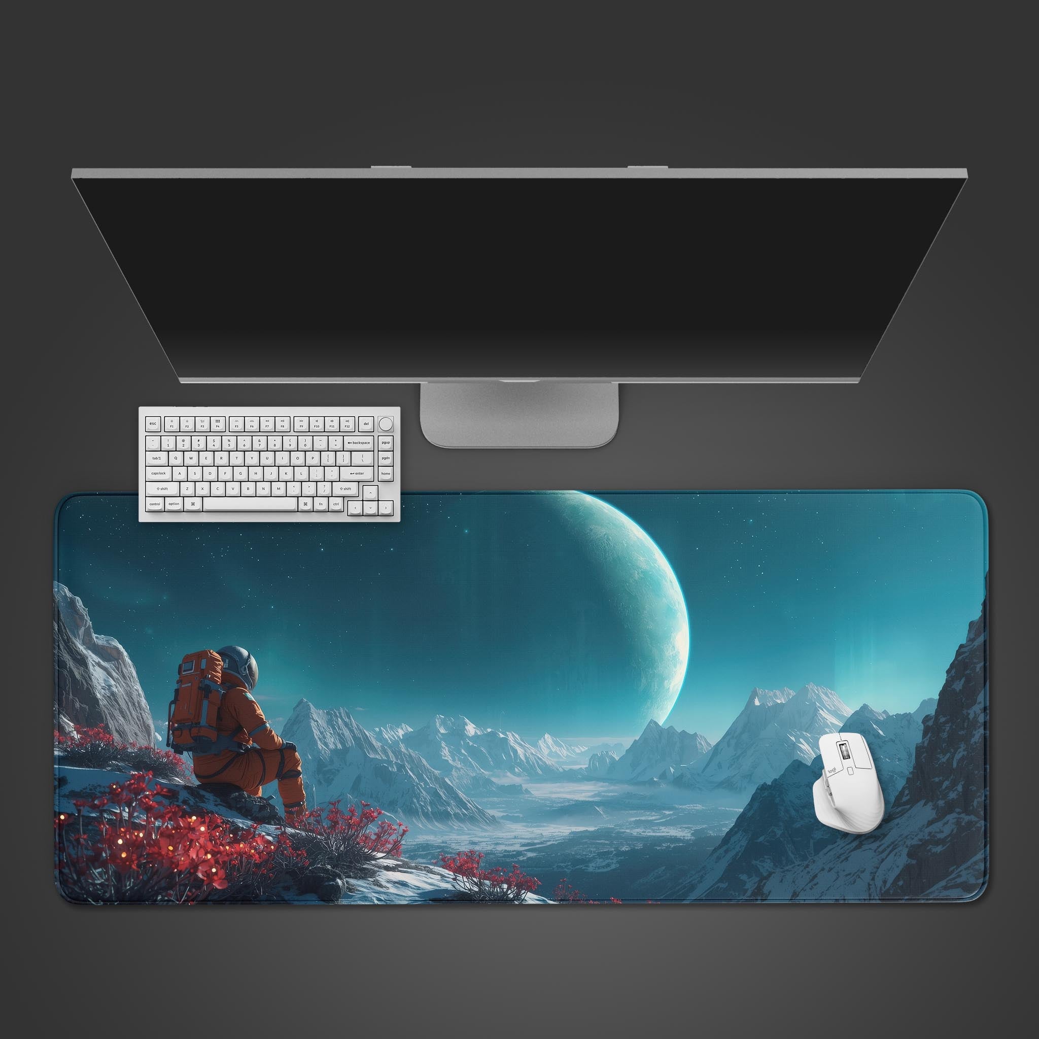 The Traveler sci-fi desk mat featuring an astronaut on an alien planet. Top-down view on a desk with a white keyboard and mouse. - Epic Design Pads & Mousepads