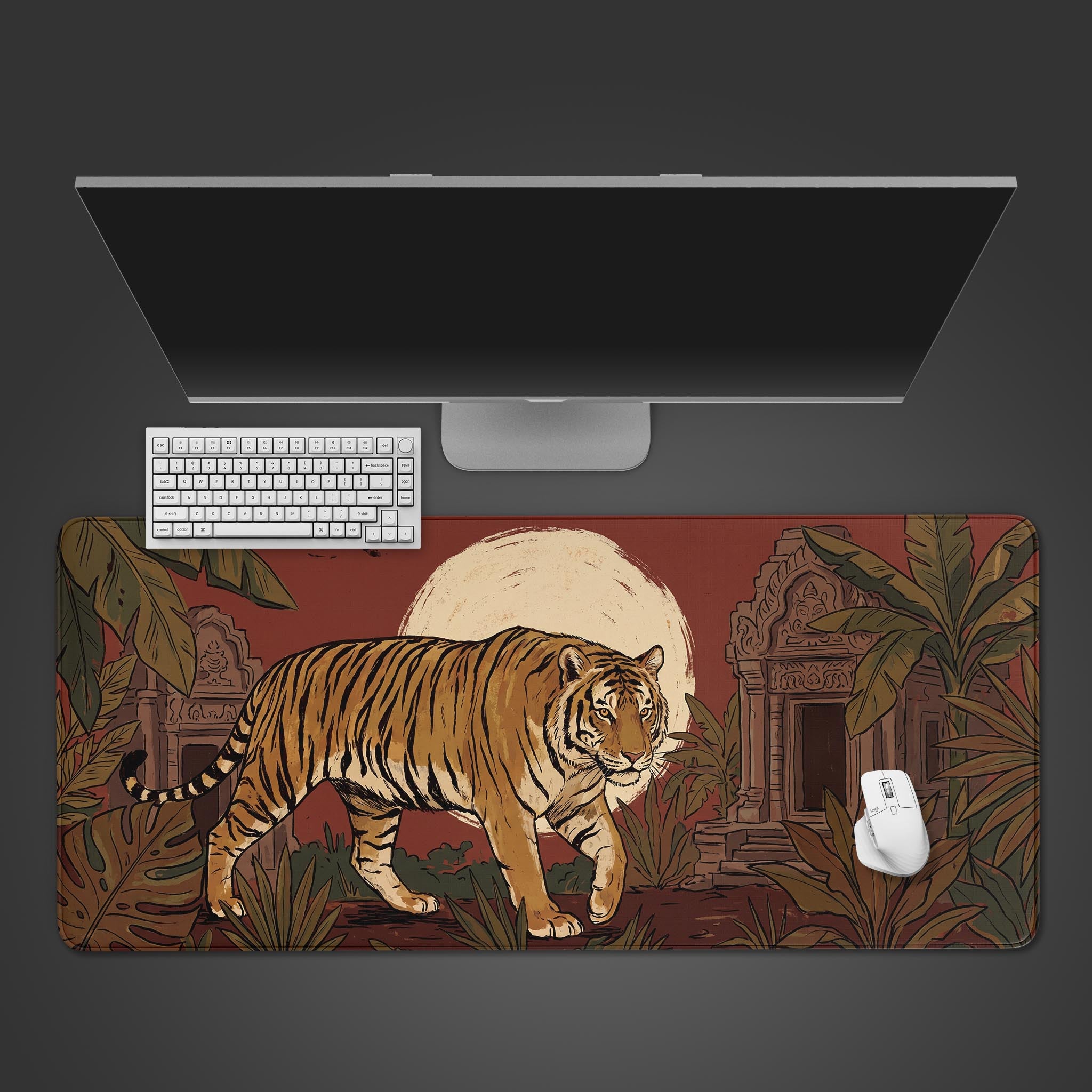 A large desk mat featuring an illustrated tiger walking past ancient jungle ruins under a giant pale sun.