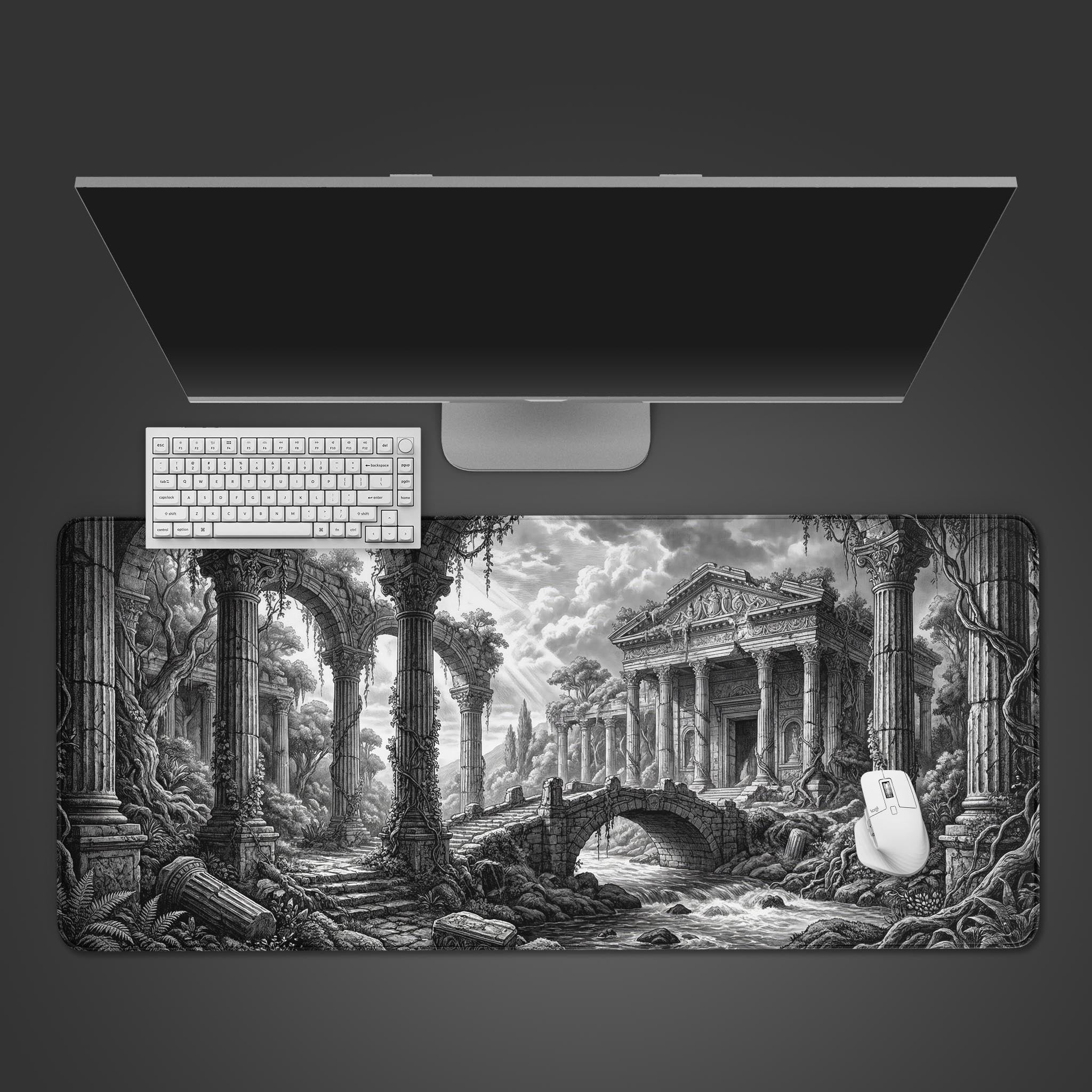 Top-down view of the Timeless Ruins Gaming Desk Mat with a detailed monochrome art style, shown with a white keyboard and mouse on a dark surface. - Epic Design Pads & Mousepads