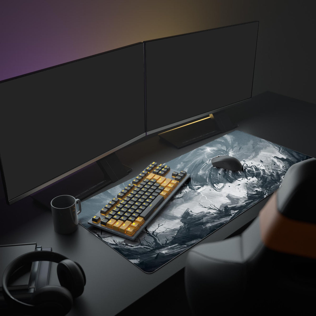 Grayscale tornado desk mat on a desk in a dark room with two monitors, orange-key keyboard, mouse, mug and headphones