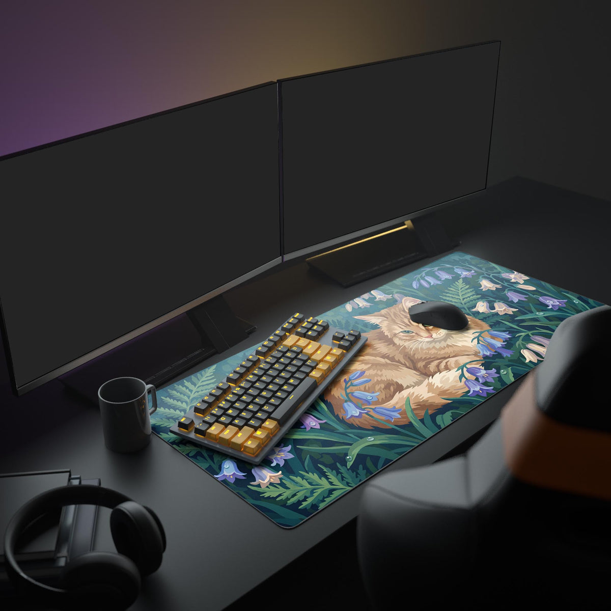 A cozy PC setup showcasing the Tranquil Tabby floral mouse pad. The ginger cat design adds a peaceful, artistic touch to the workspace with a monitor and keyboard. - Epic Design Pads & Mousepads