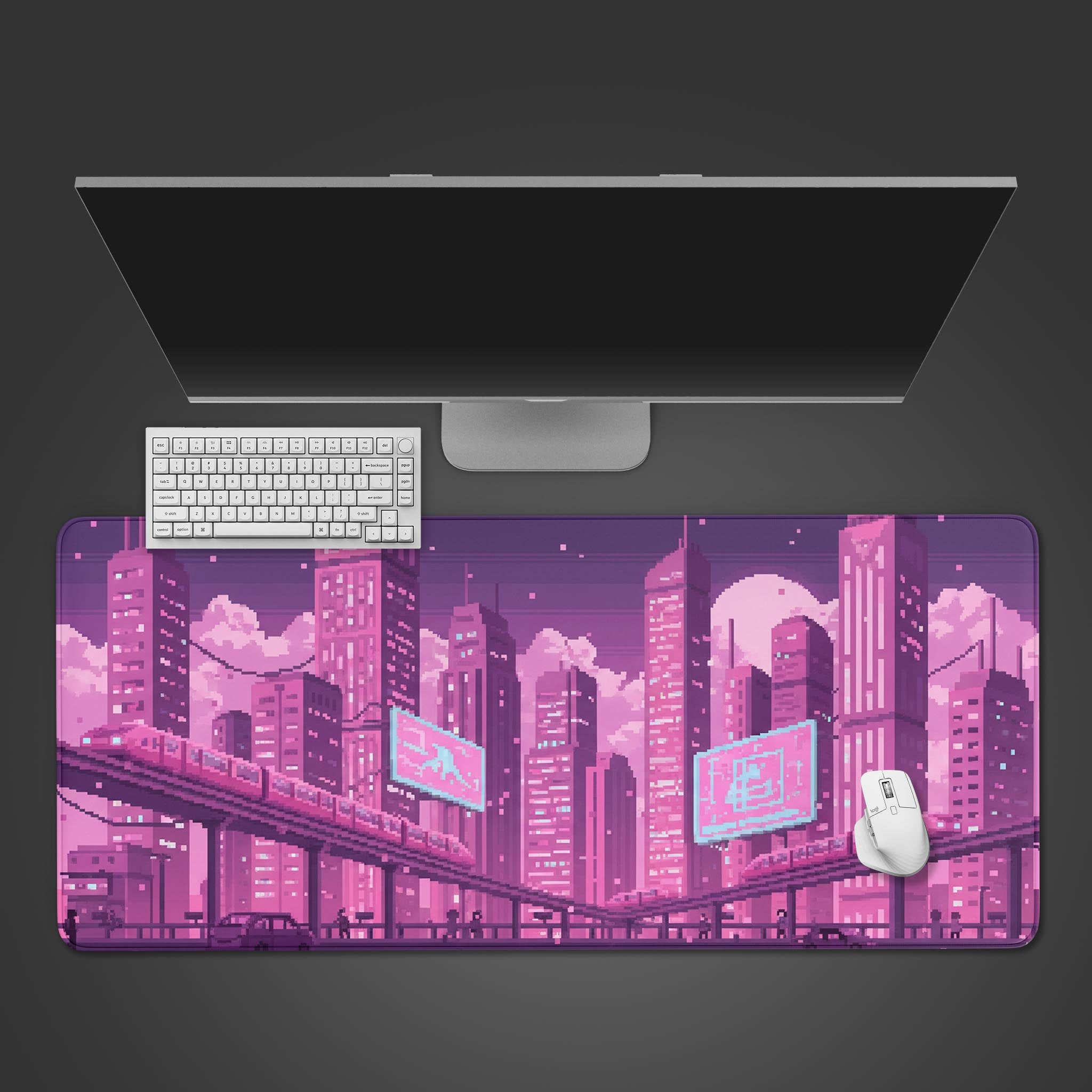 Twilight Express pixel art desk mat with a purple 8-bit cityscape, shown on a desk with a keyboard and mouse. - Epic Design Pads