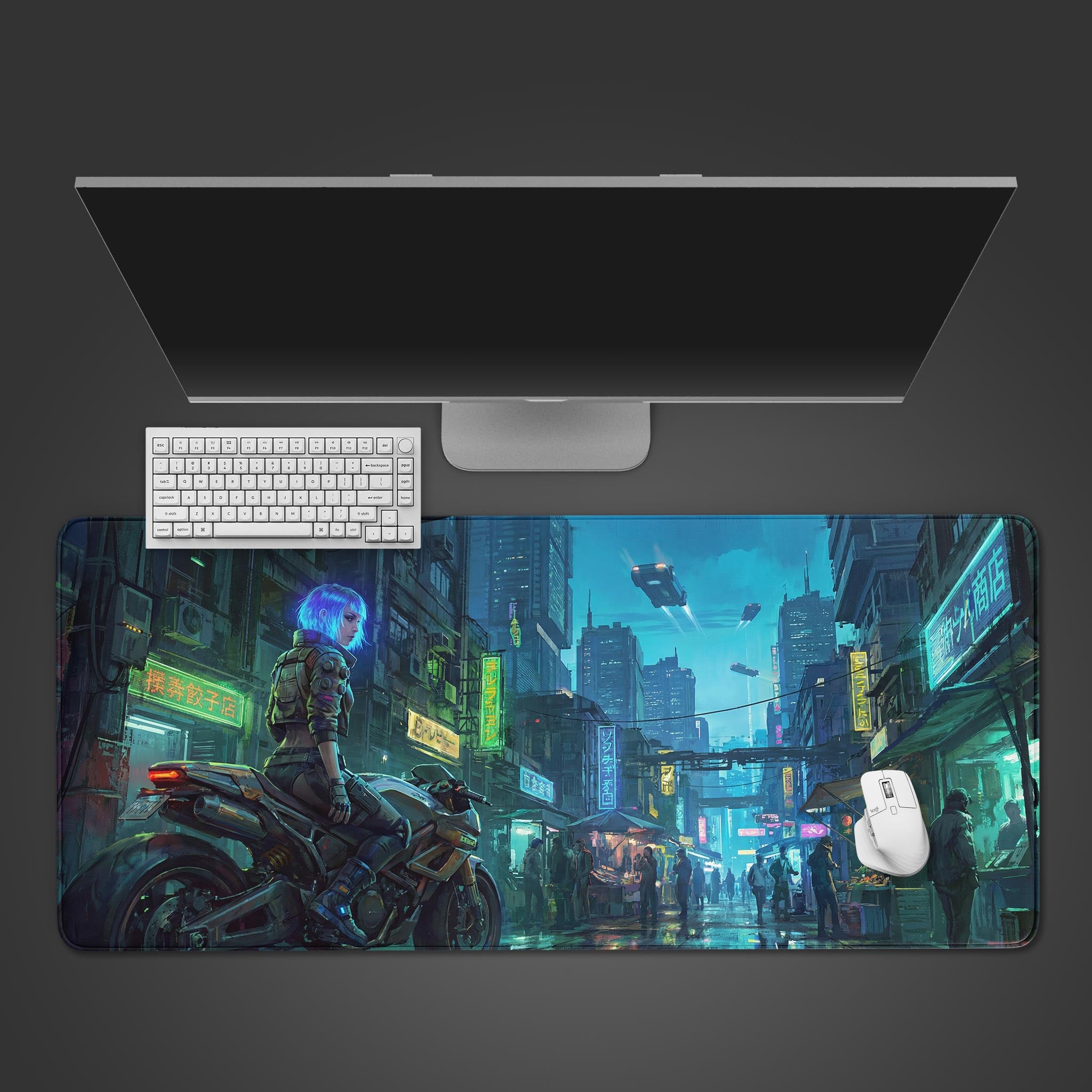 The Urban Rebel gaming desk mat displayed on a desk with a white keyboard and monitor, showcasing its futuristic cyberpunk city art from a top-down view. - Epic Design Pads & Mousepads