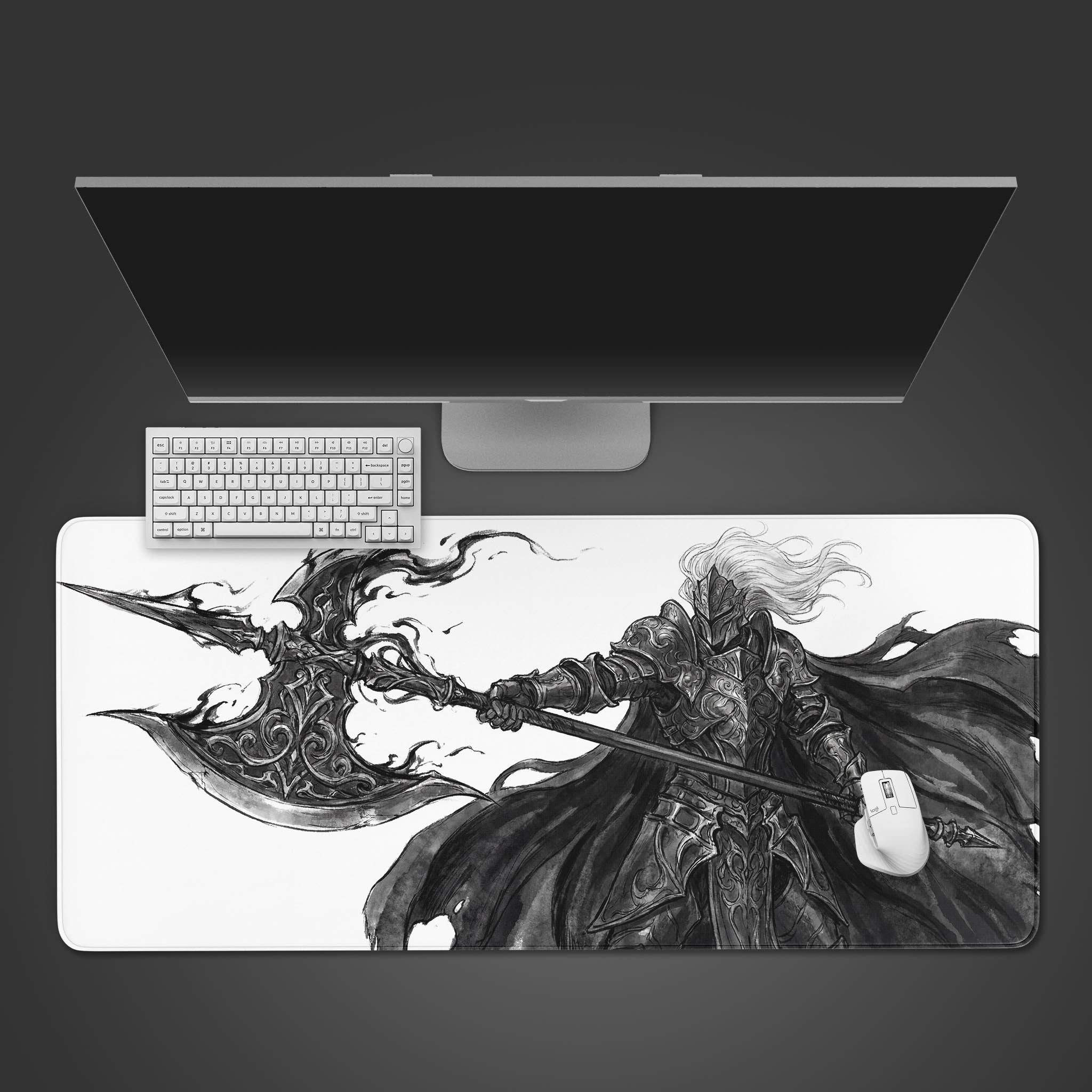 A top-down view of the Void Vanguard gaming desk mat, featuring a monochrome knight with a halberd. A white keyboard and mouse are placed on the mat below a large monitor. - Epic Design Pads & Mousepads