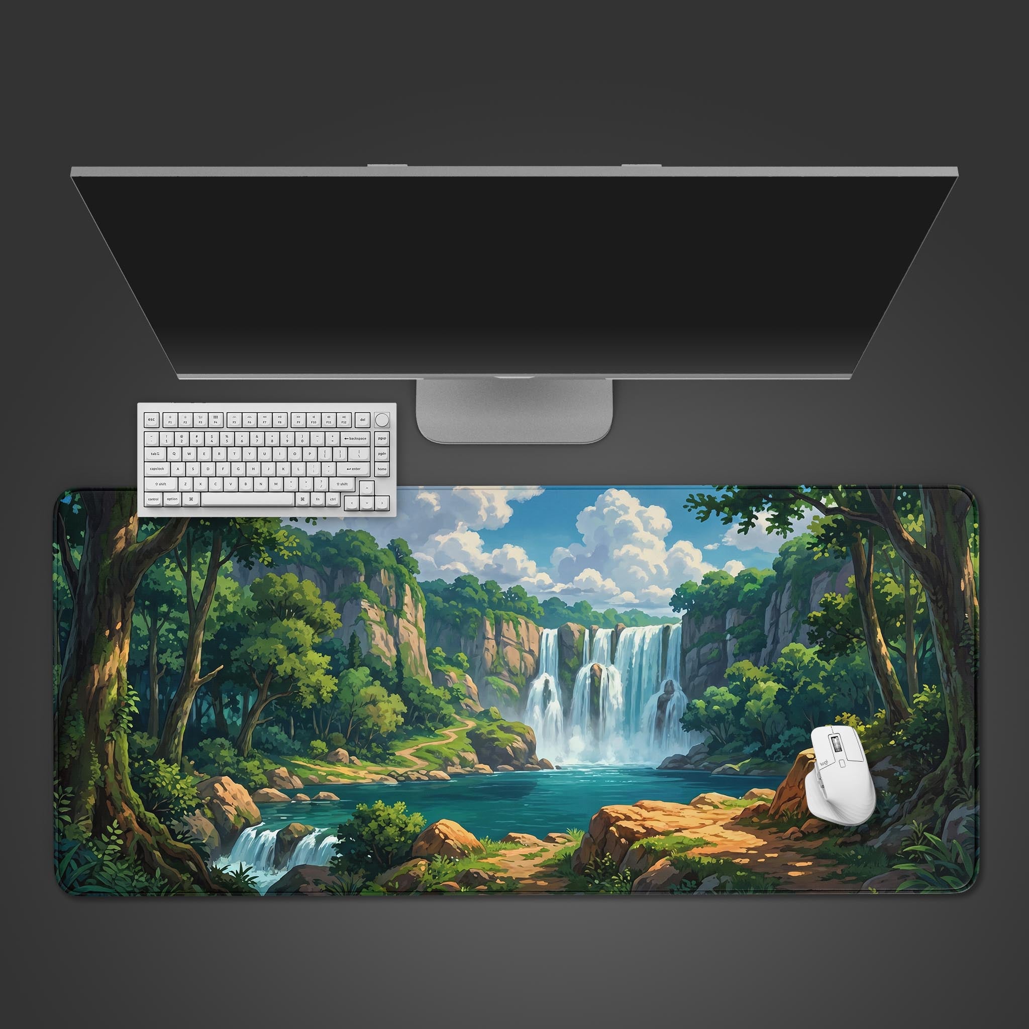 Forest Falls desk mat featuring a lush green landscape and a cascading waterfall