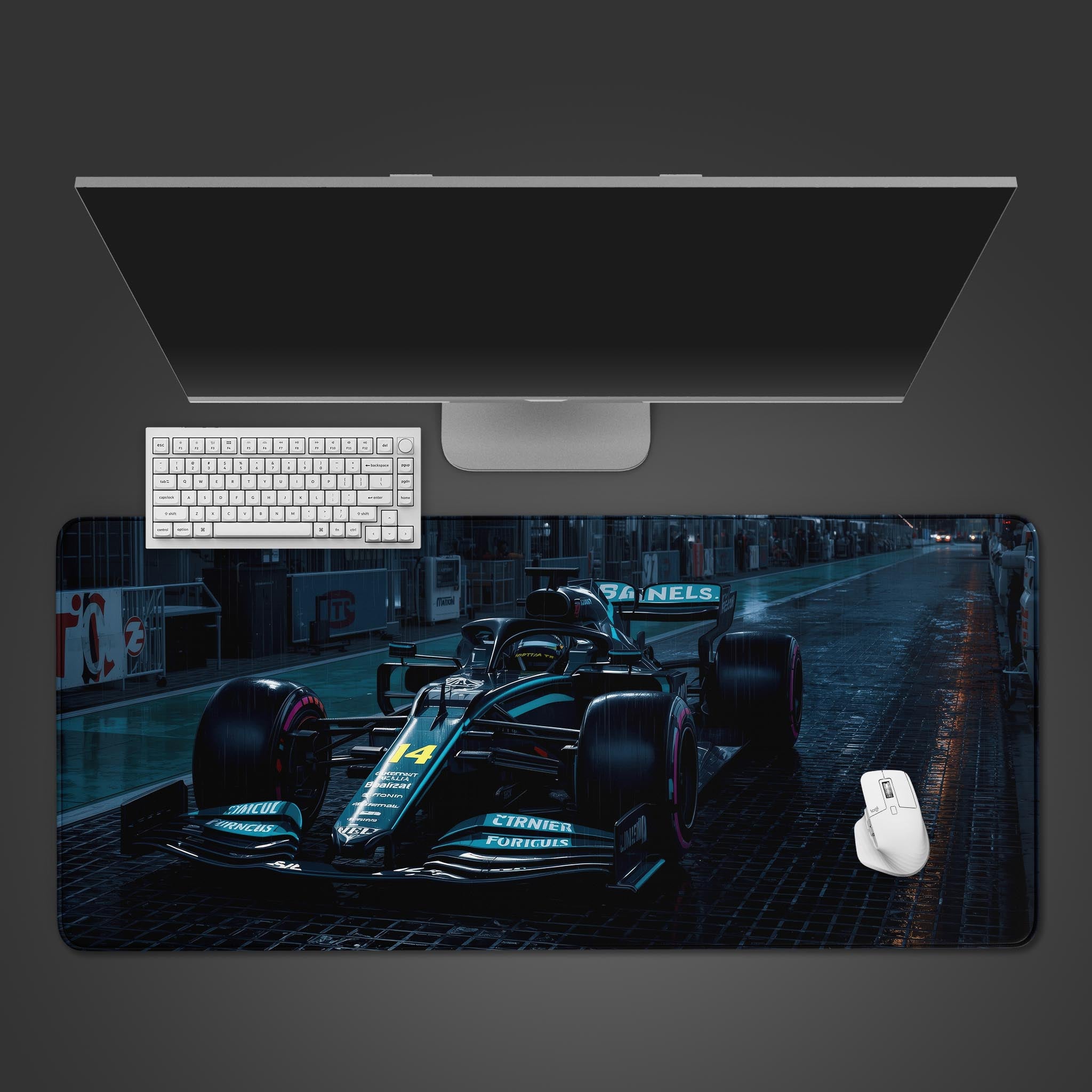 Wet Track racing desk mat with a race car on rain-slicked tarmac, shown from a top-down view with a keyboard and mouse. - Epic Design Pads