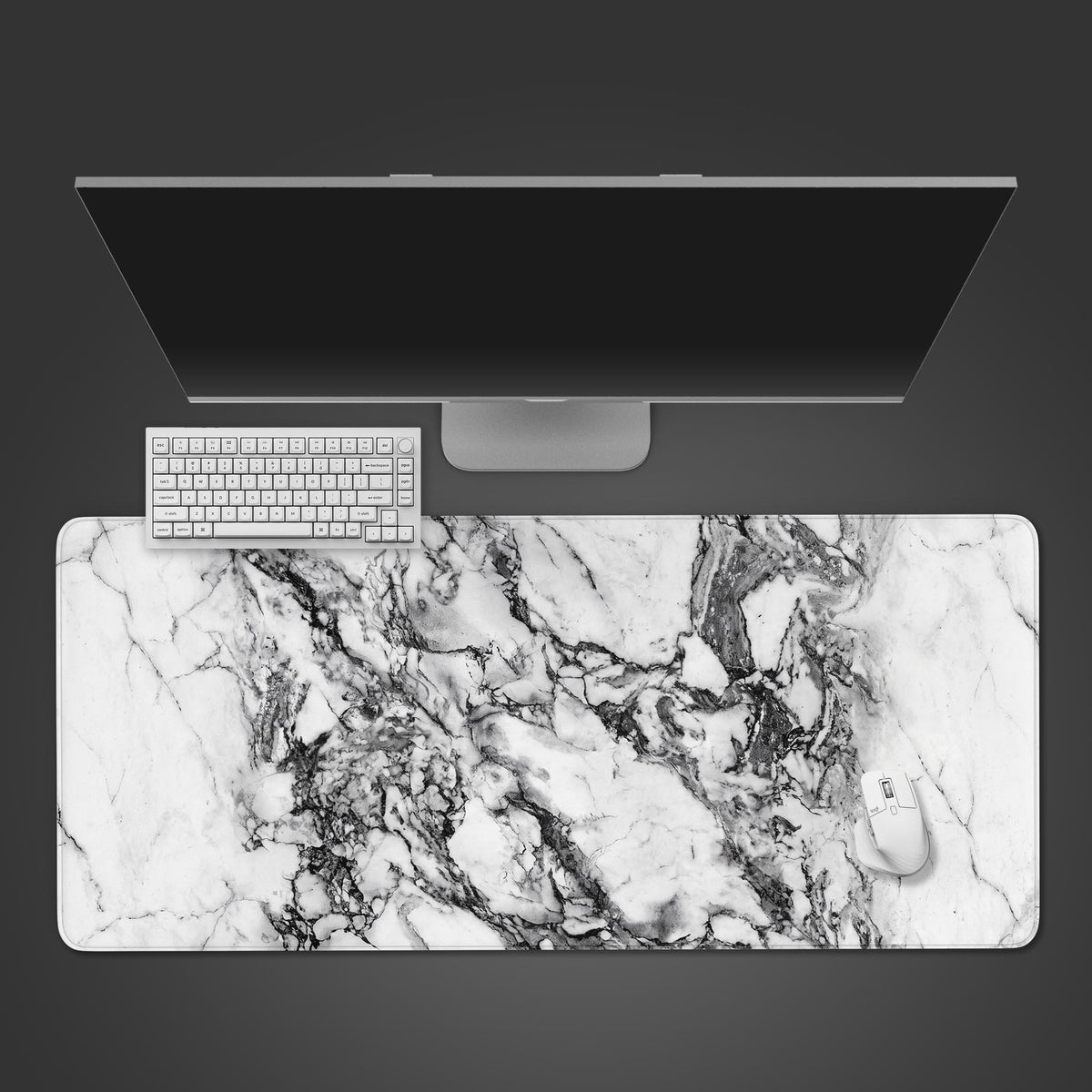 A white desk mat featuring a realistic white and grey marble texture with high-contrast veining.