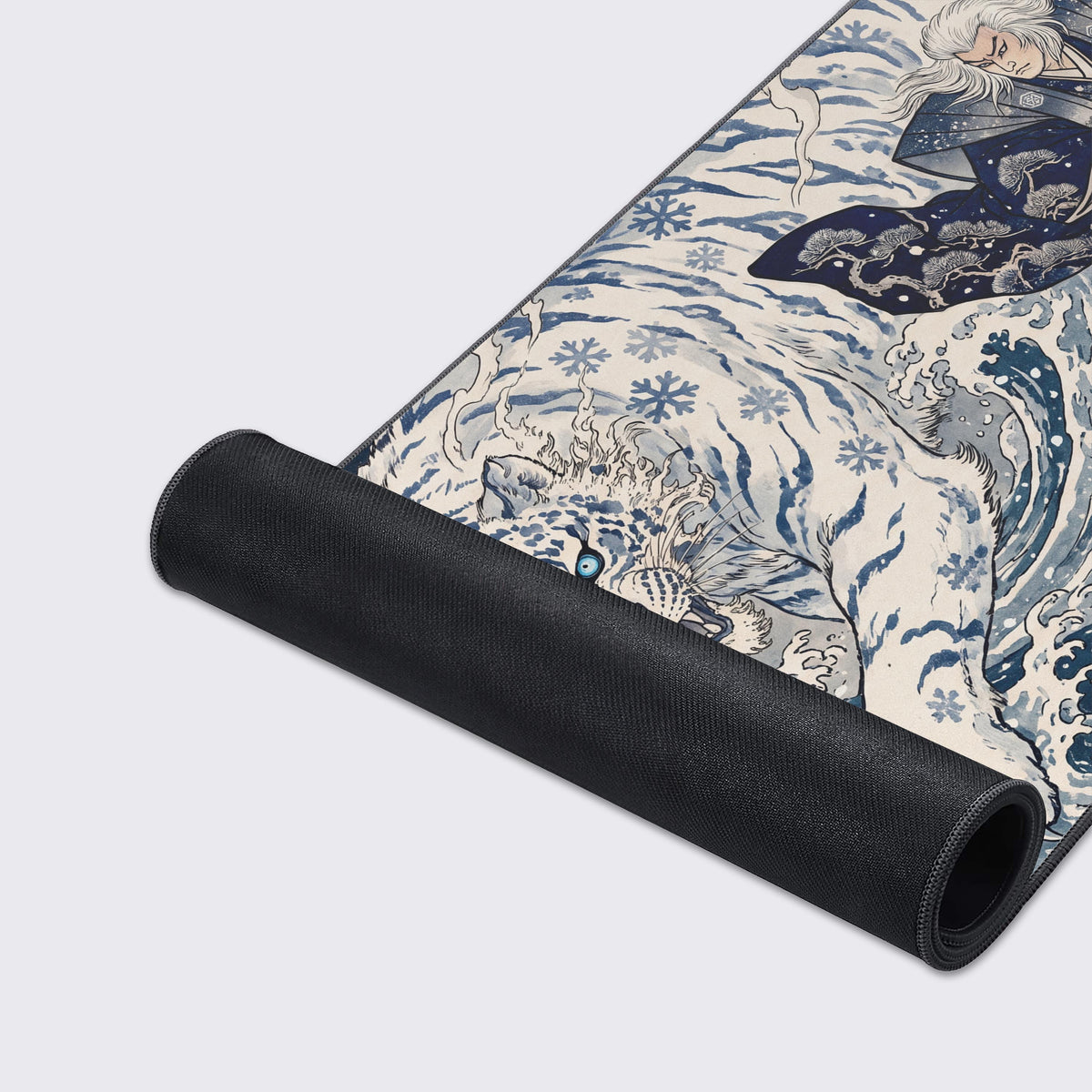 Close-up of the desk mat showing the stylized white tiger with blue markings roaring through snowy waves.