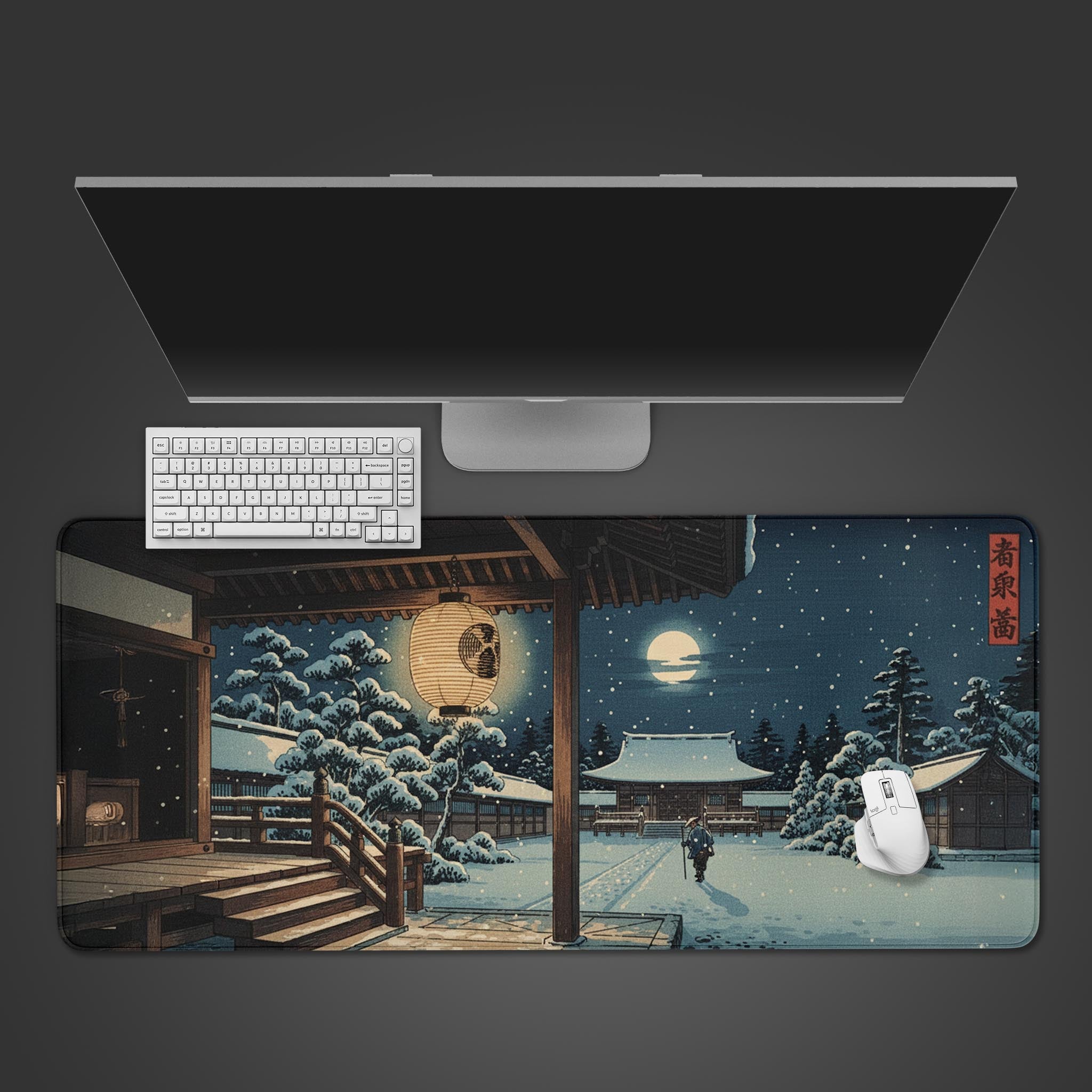 Winter Sanctuary Japanese desk mat showing a snowy temple scene, viewed from above with a white mechanical keyboard and mouse. - Epic Design Pads