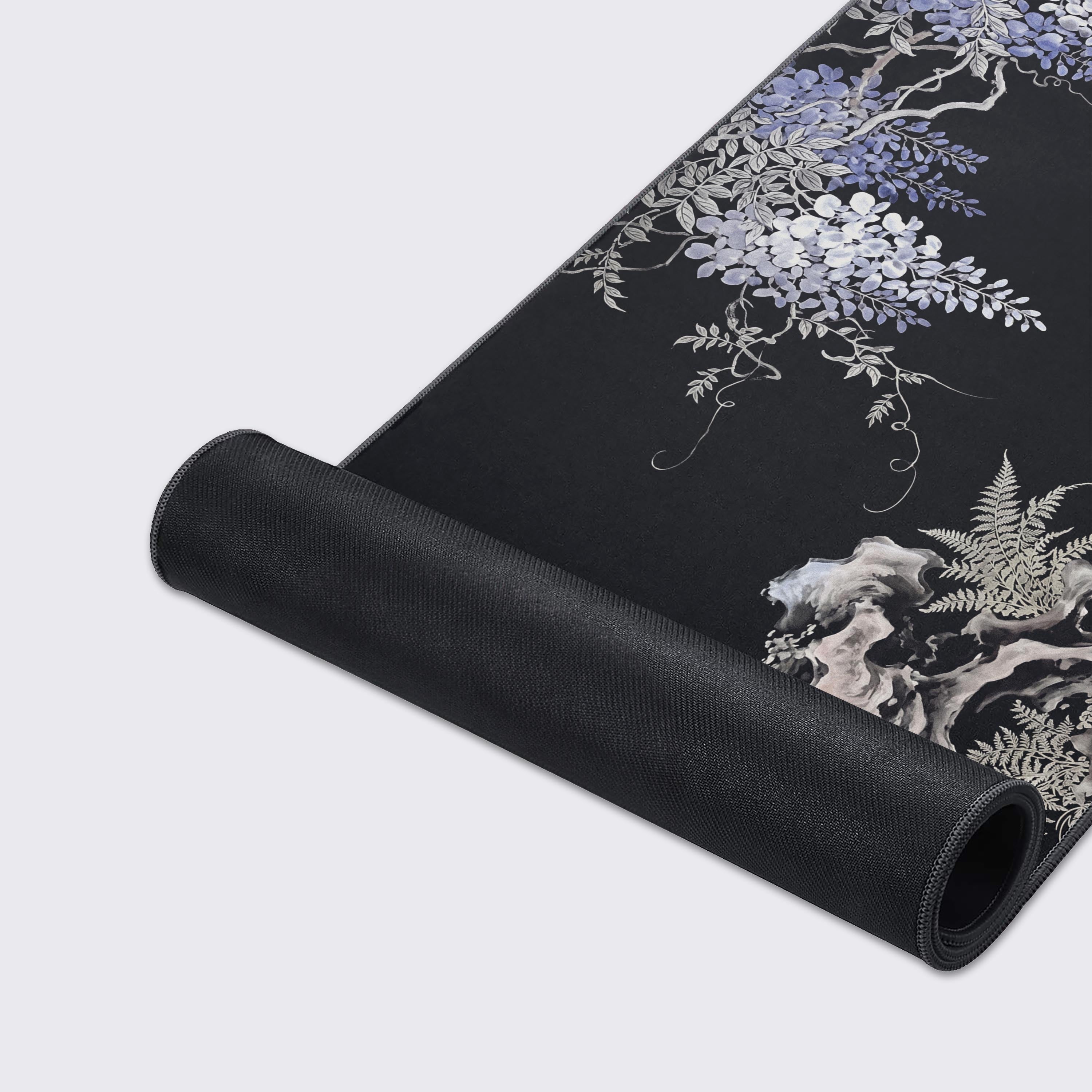 Detailed view of the gnarled branches, delicate ferns, and traditional calligraphy on the wisteria gaming mat
