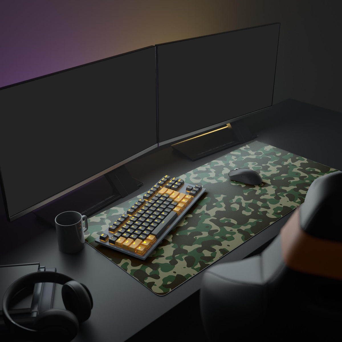 Large Woodland Camo gaming desk mat in a full desk setup with dual monitors, mechanical keyboard, and headphones, creating a military-themed workspace. - Epic Design Pads