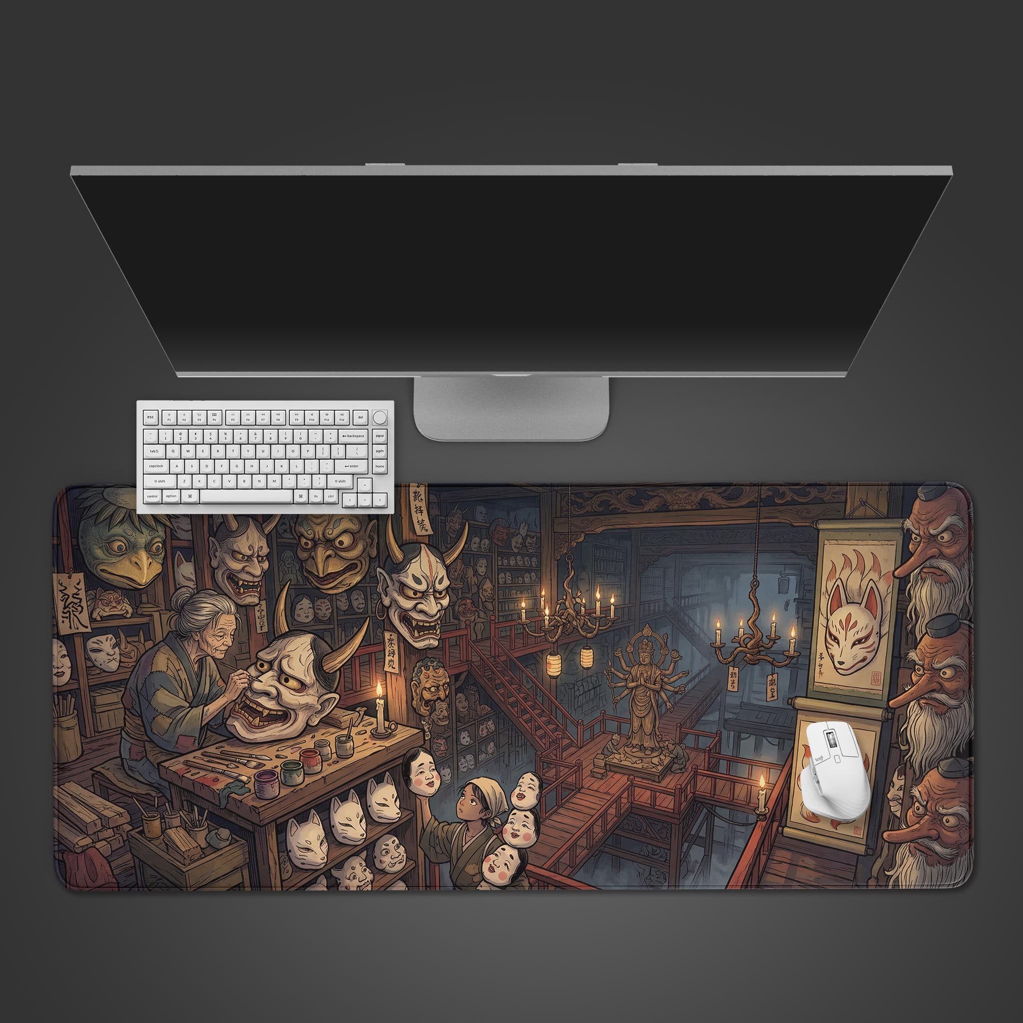 Top-down view of the Yokai Mask Maker gaming desk mat, showing the detailed Japanese art beneath a sleek monitor, white keyboard, and mouse. - Epic Design Pads & Mousepads